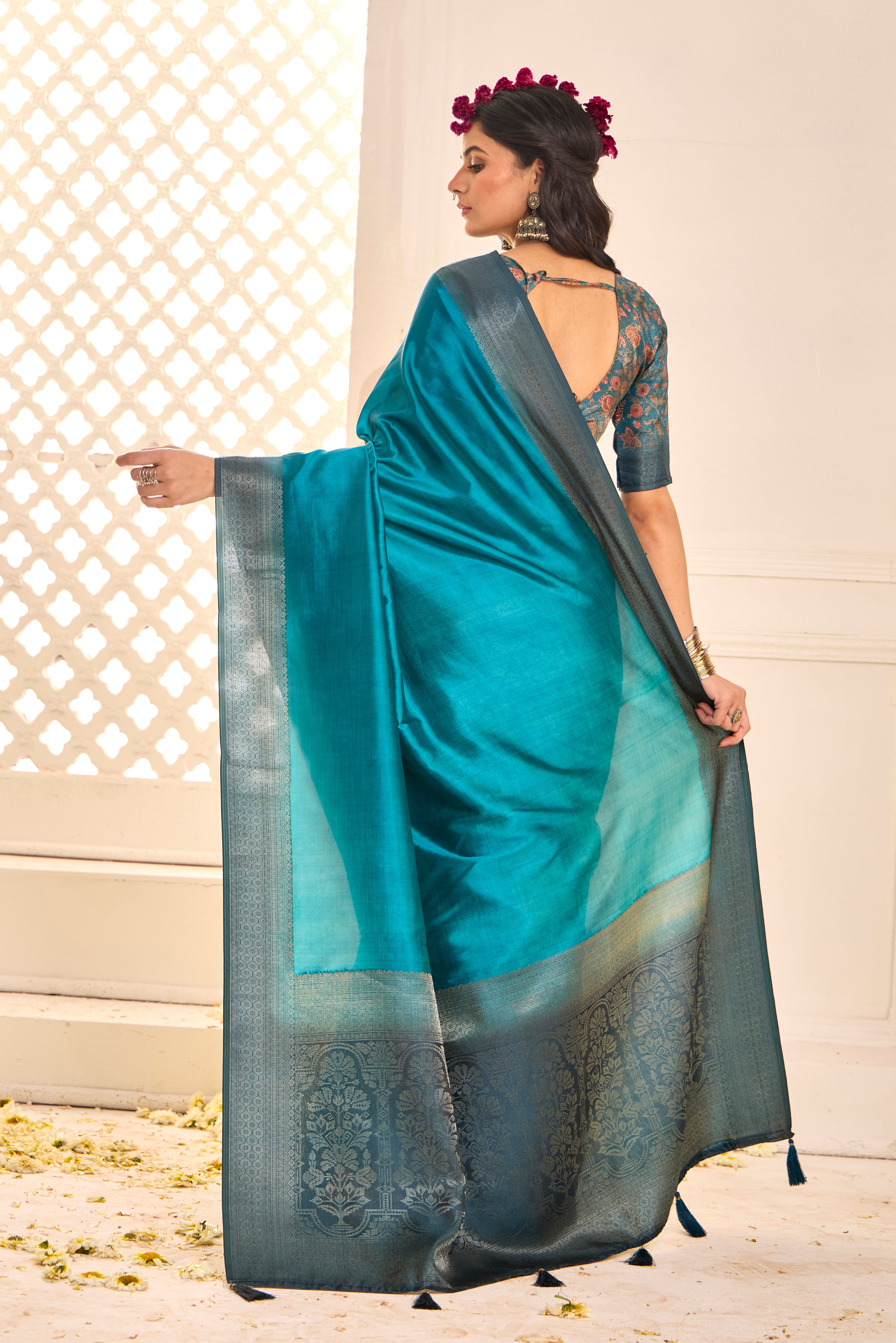 A sky blue and black tissue silk Banarasi style saree