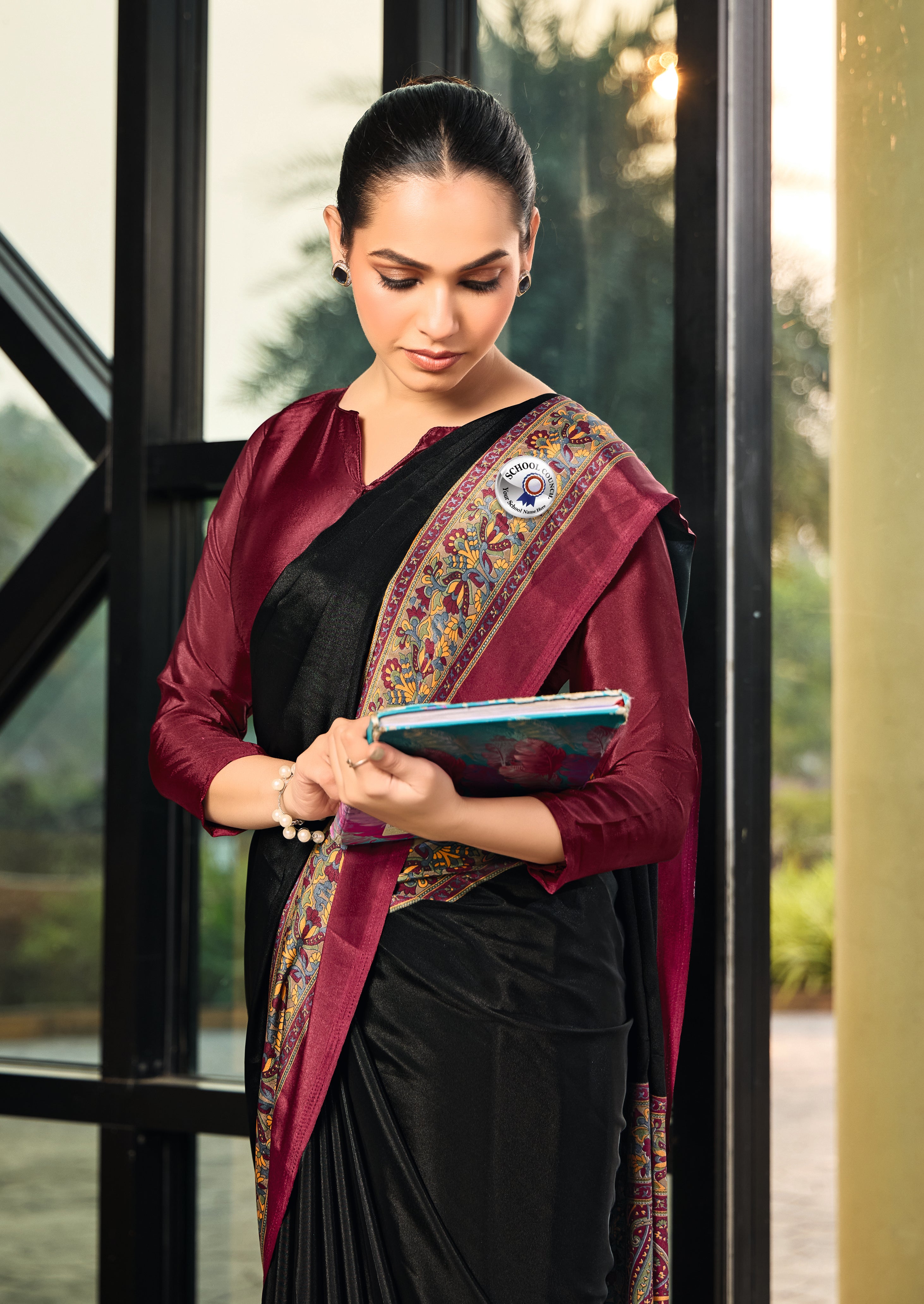 black and maroon crepe silk saree with detailed embroidery along the border and blouse under 1500