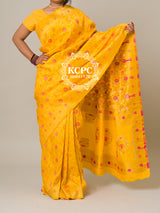 A yellow banarasi silk saree with floral patterns and zari embellishments.