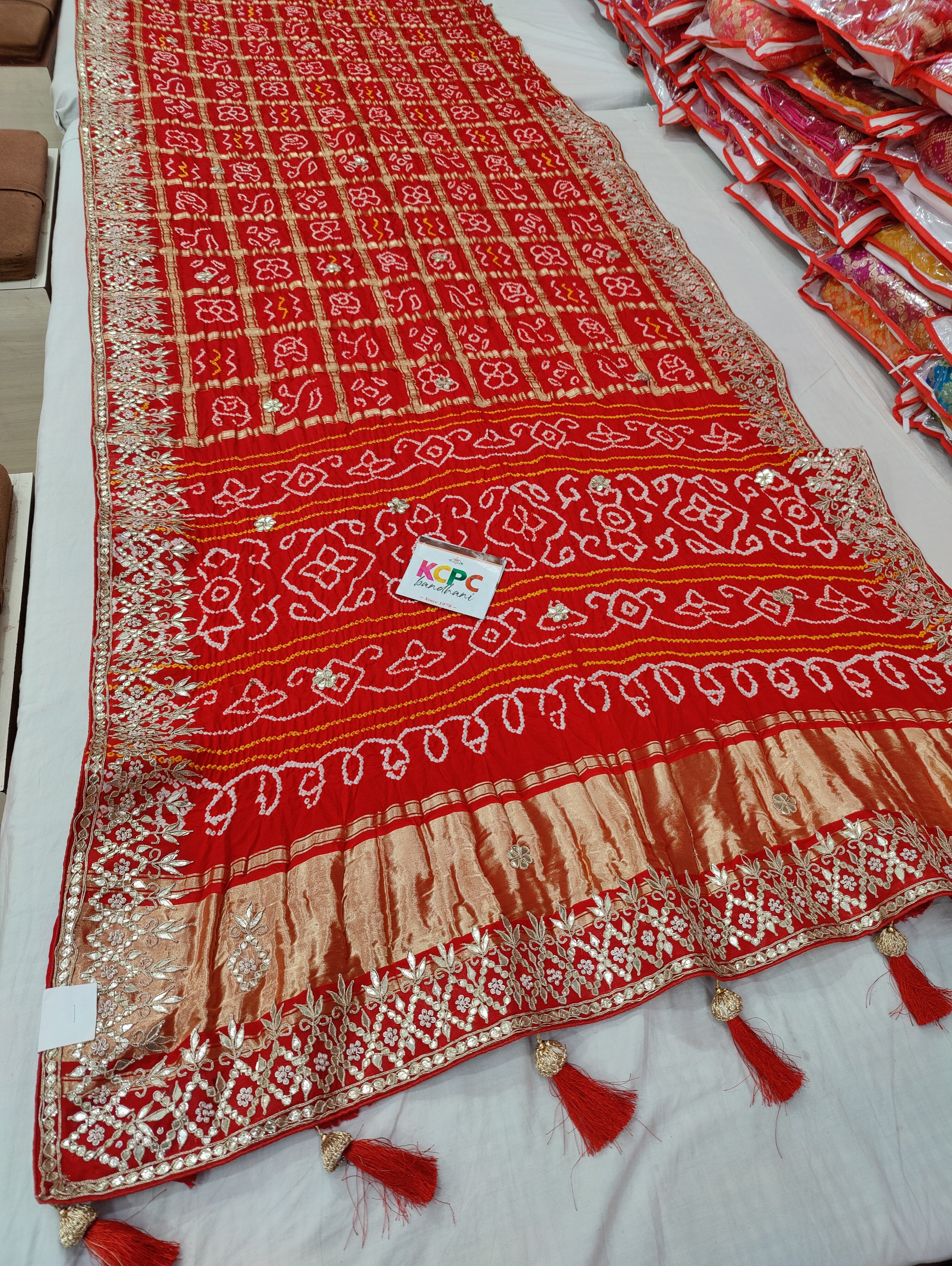 Bandhani style design saree for wedding in red colour