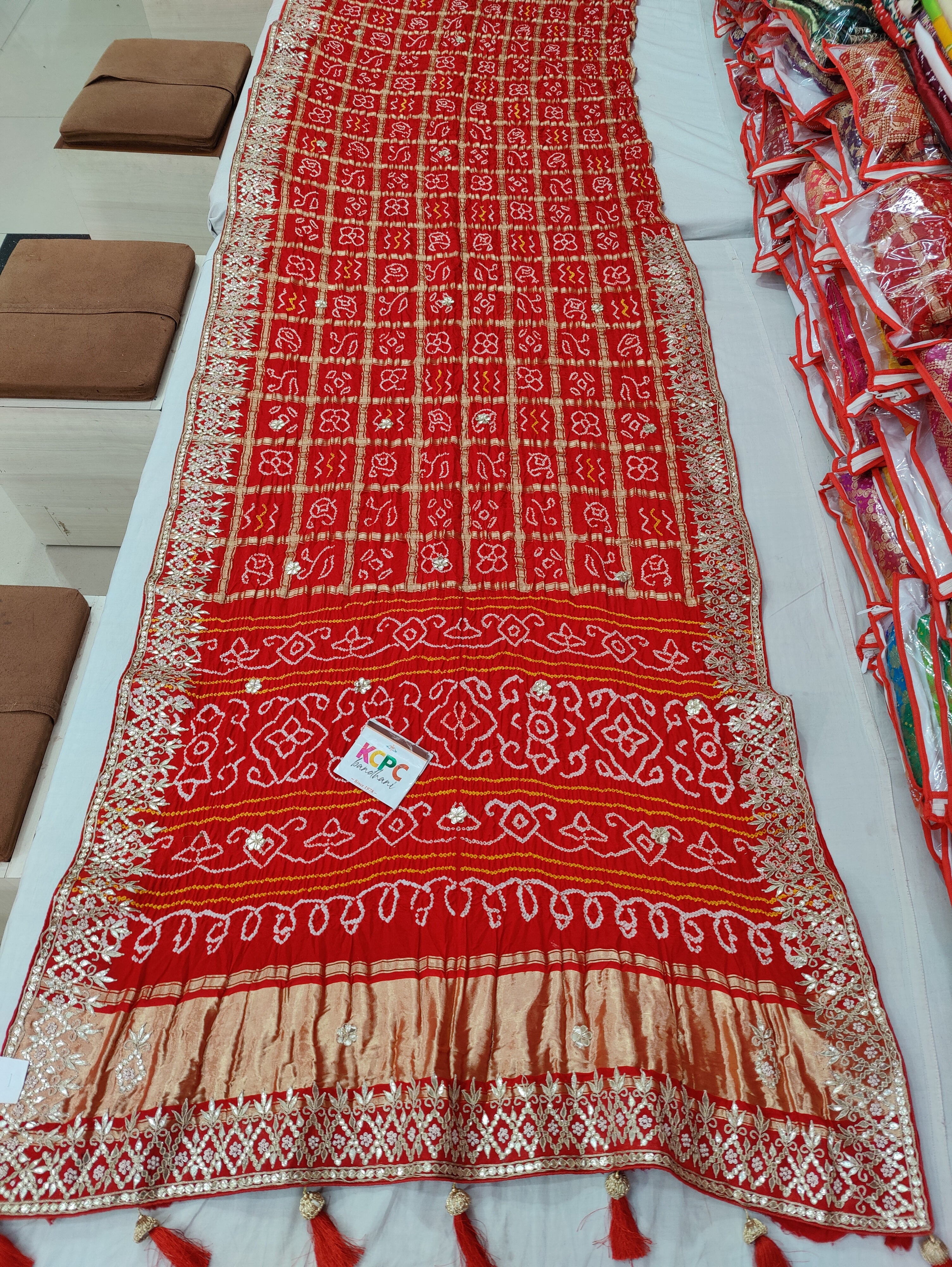 Bandhani style design saree for wedding in red colour