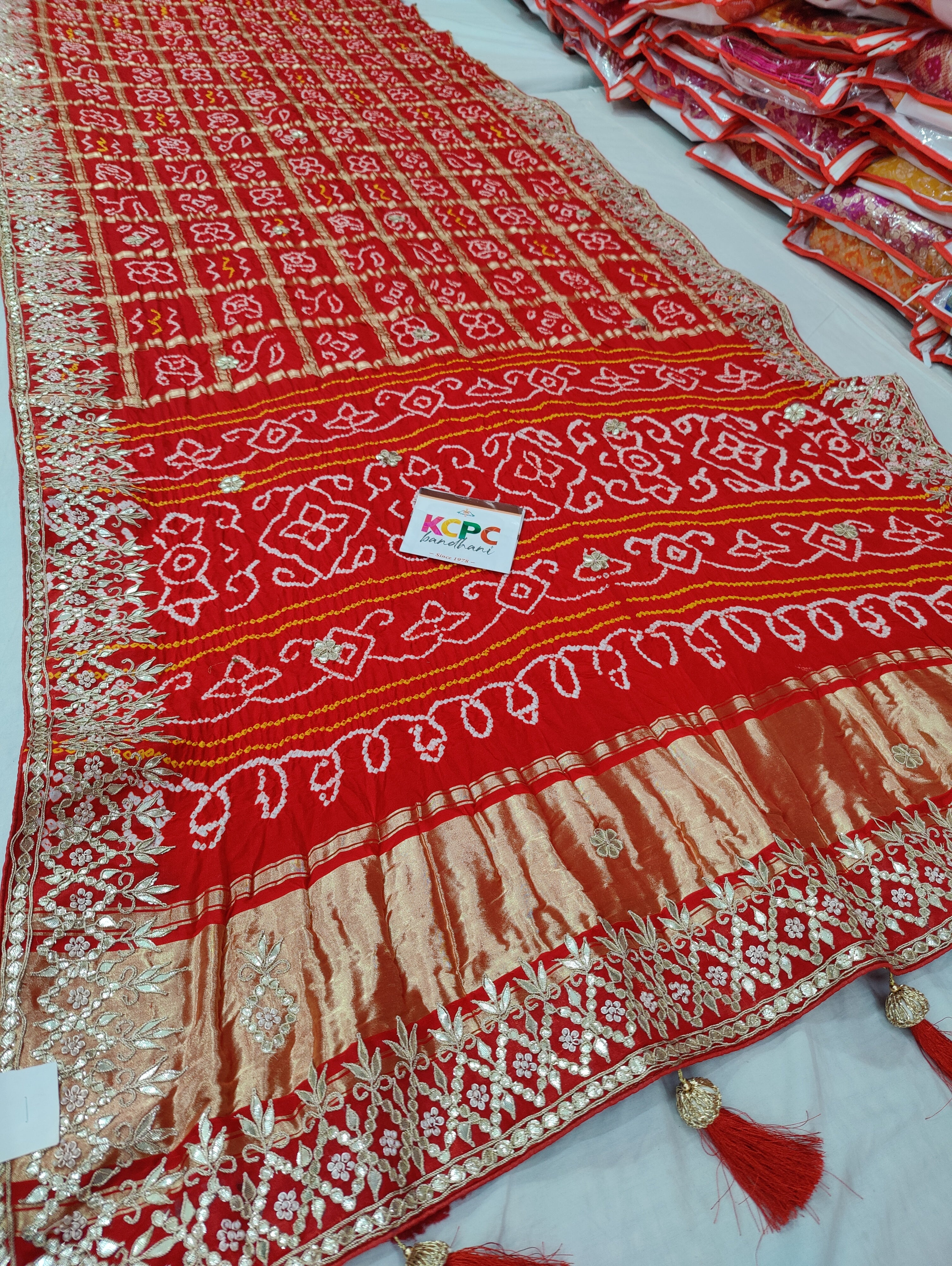 Bandhani style design saree for wedding in red colour