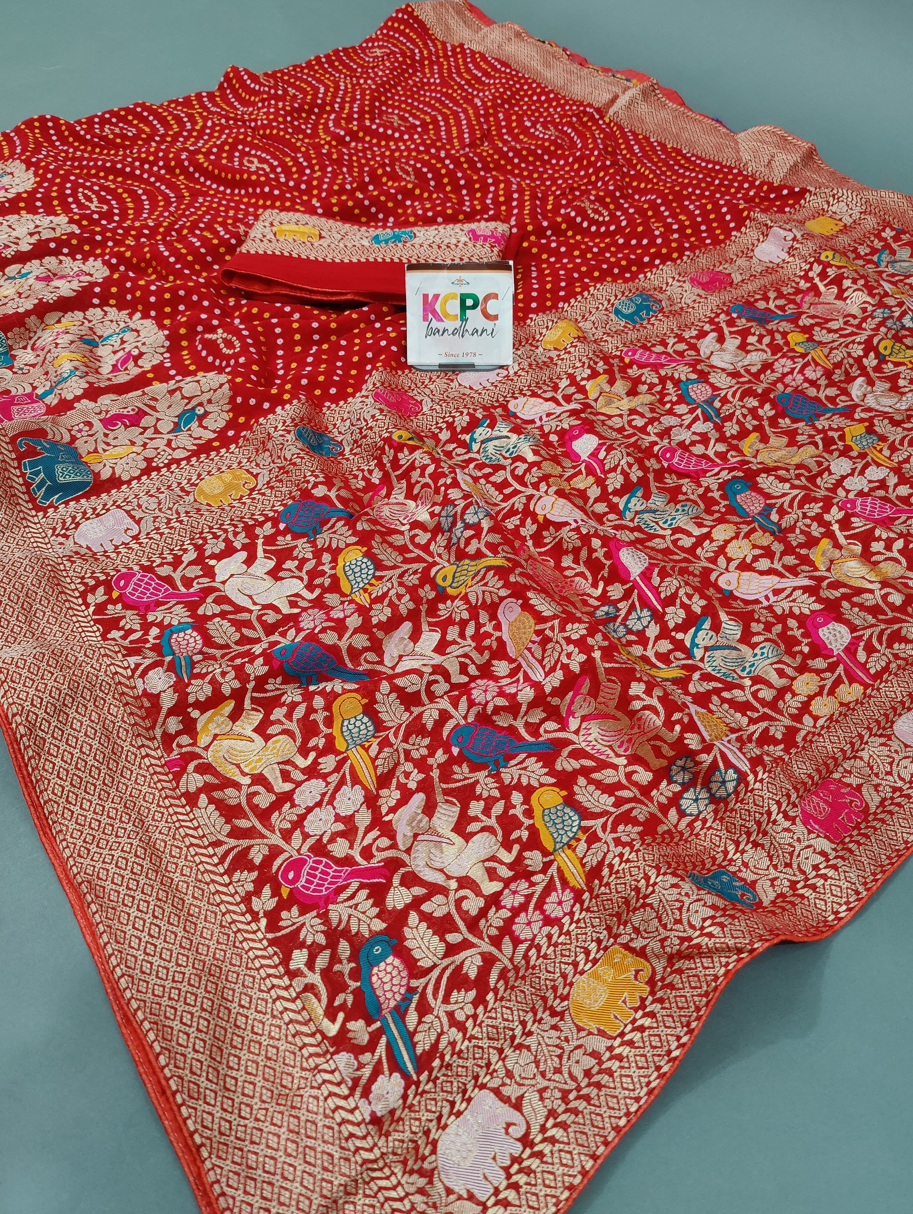 A red and gold Jaipuri Bandhej Weaving saree