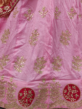 A pink lehenga set with dupatta and gotapati work