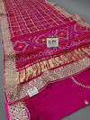 A pink silk saree with luxury gotapatti work