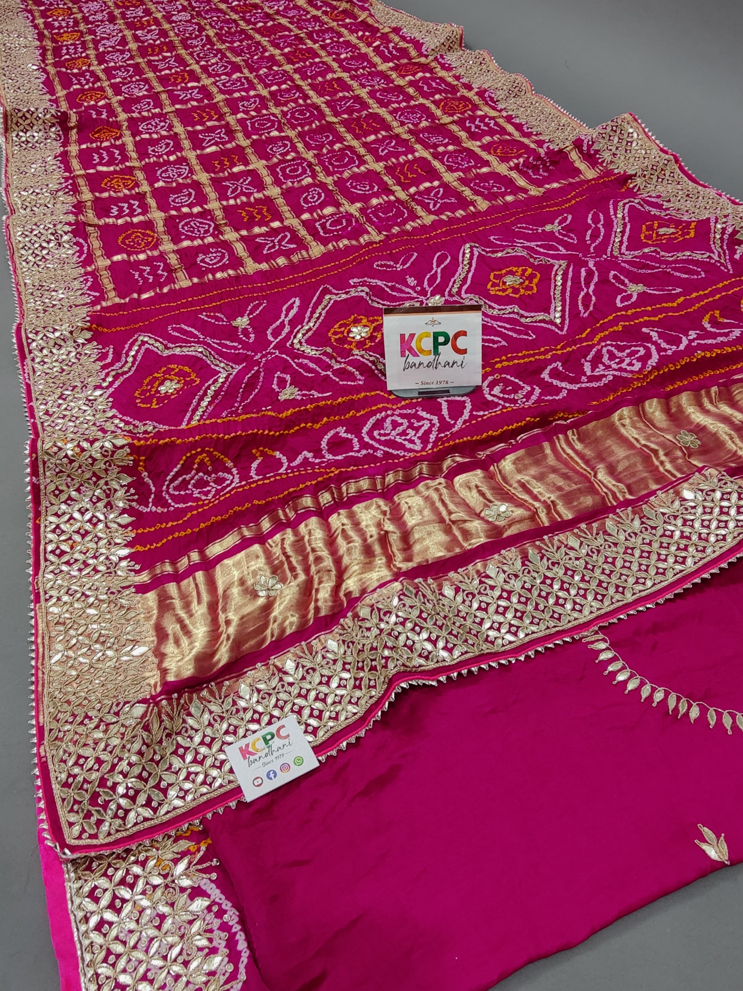 A pink silk saree with luxury gotapatti work