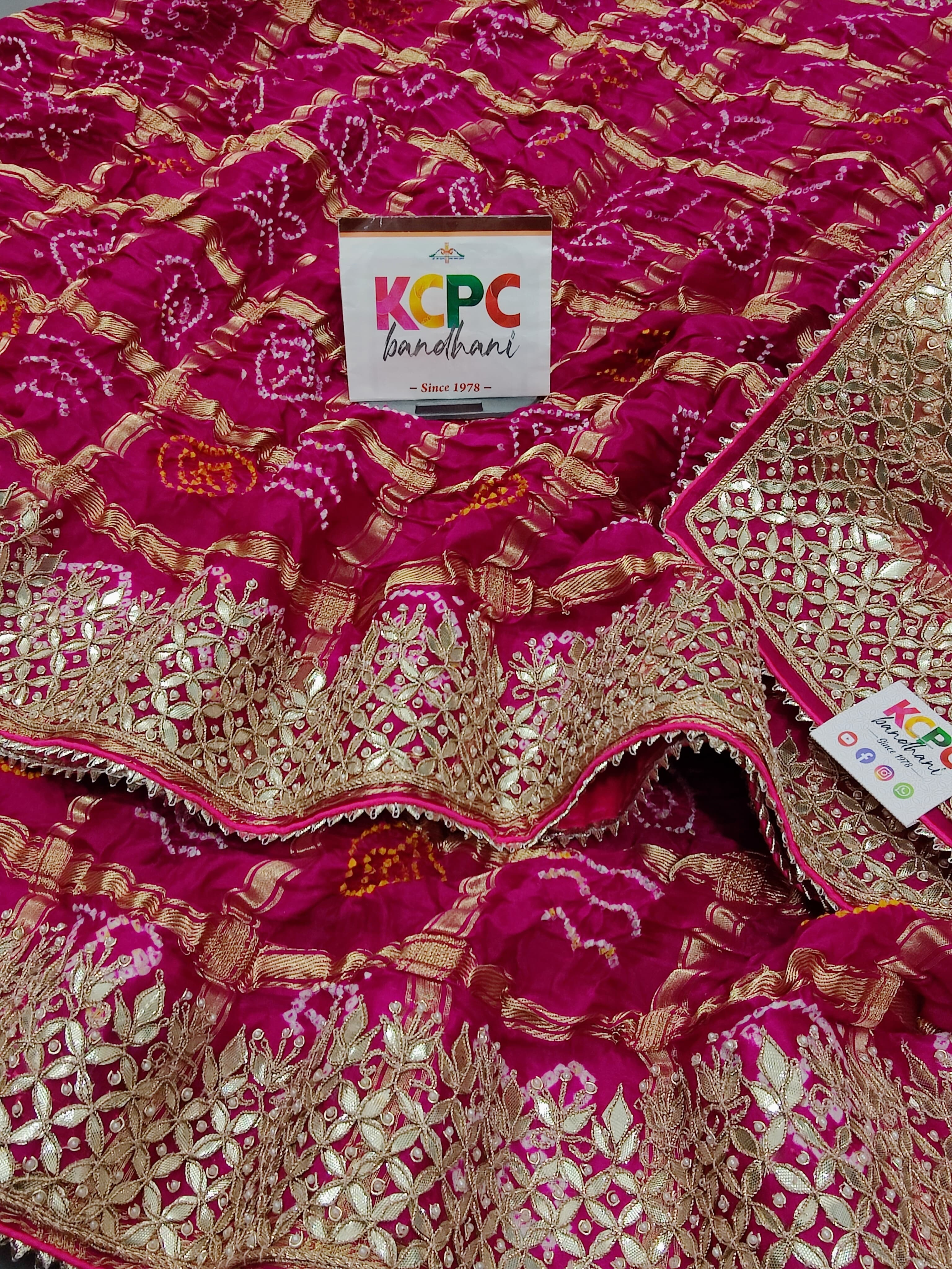 A pink silk saree with luxury gotapatti work