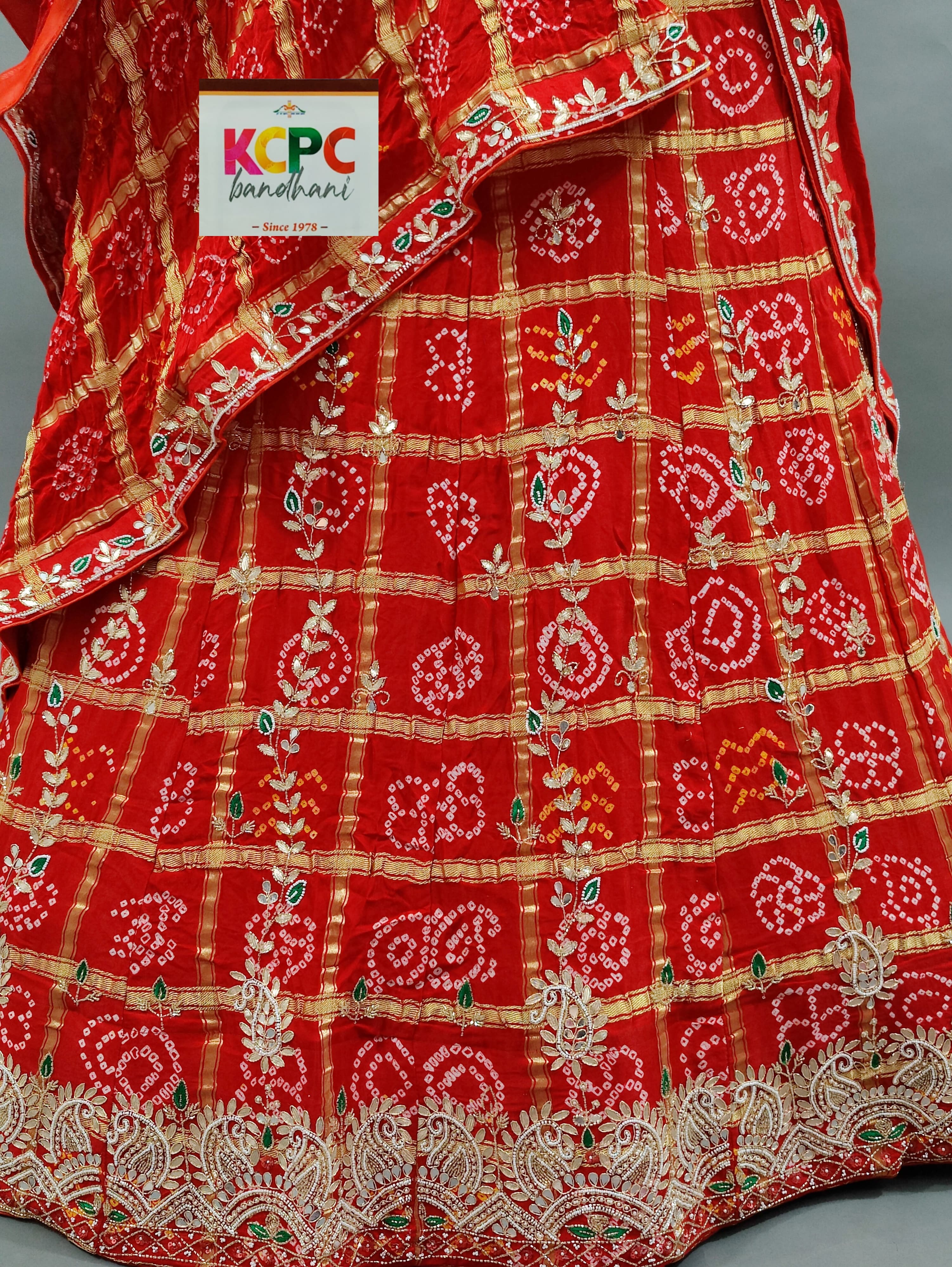 Gaji Silk Bandhani Ghatchola style lehenga in red colour