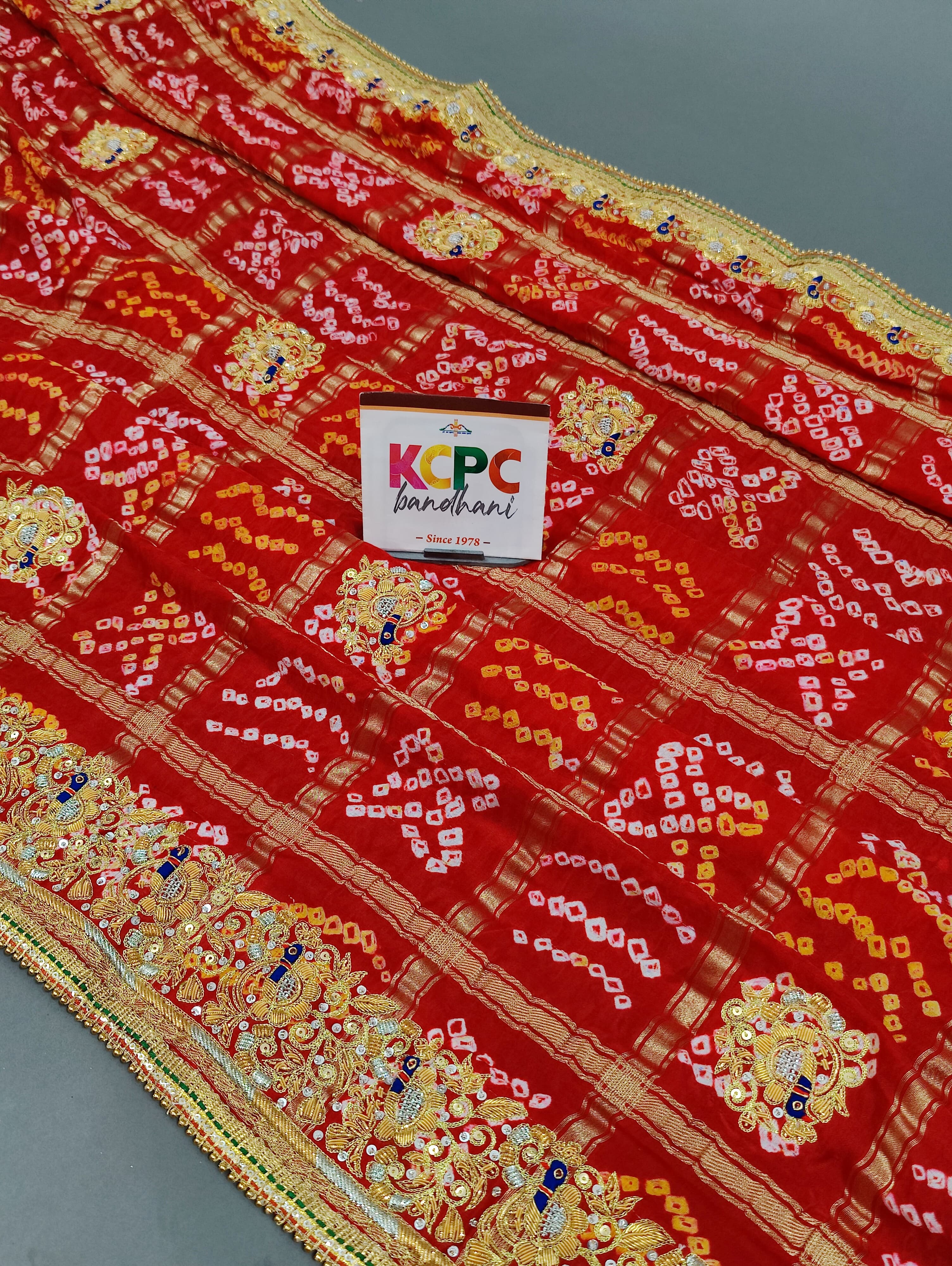 KcPc Mahajani Trending Pure Gaji Silk Bandhani Zardoji Ghatchola Chunri Pila Odhna (Red Orange)
