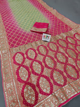 A pink georgette saree with floral and gota patti