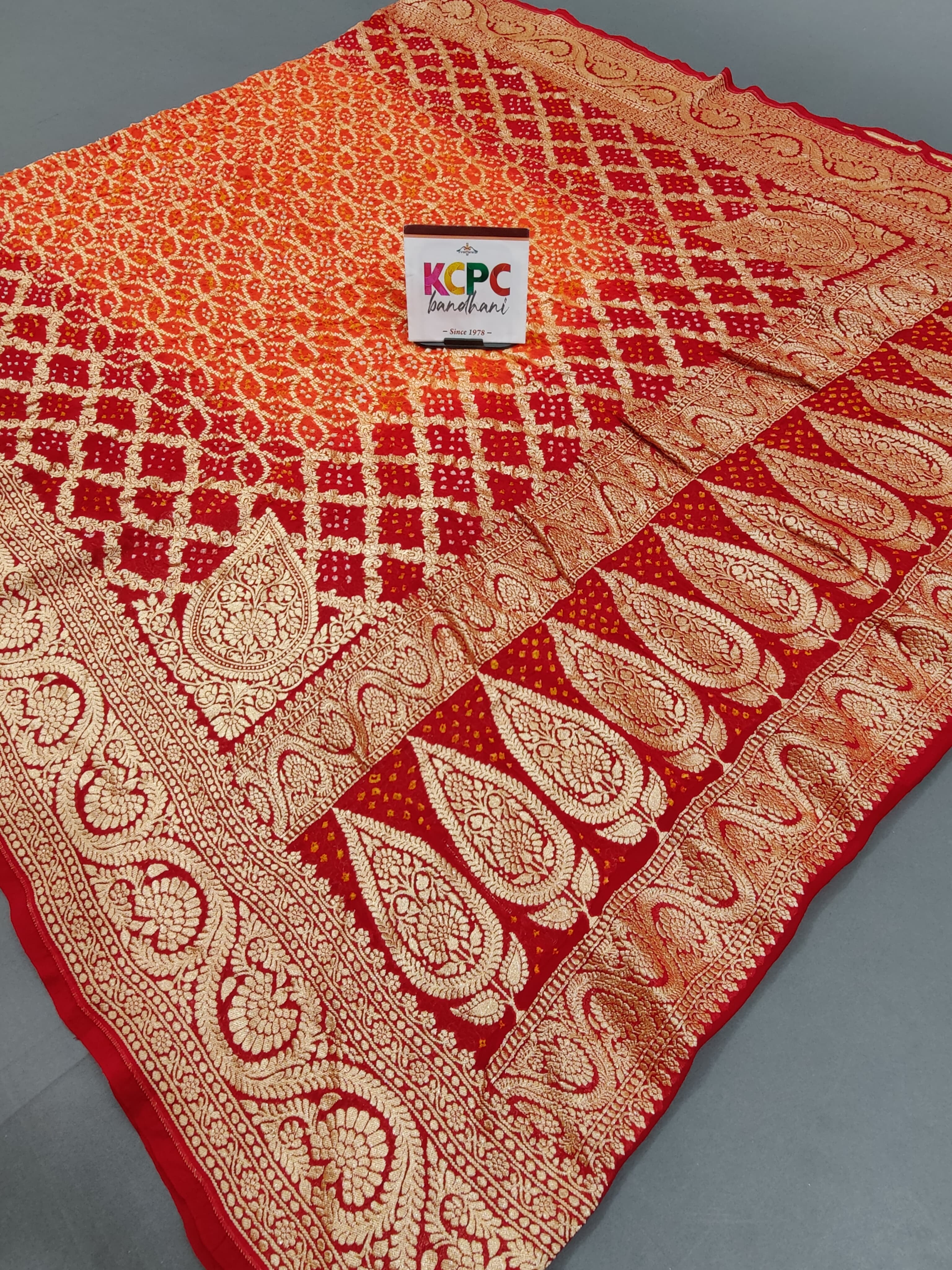 KcPc New Launch Pure Khaddi Georgette Upada Neemzari Bandhej DupattaOrange Red