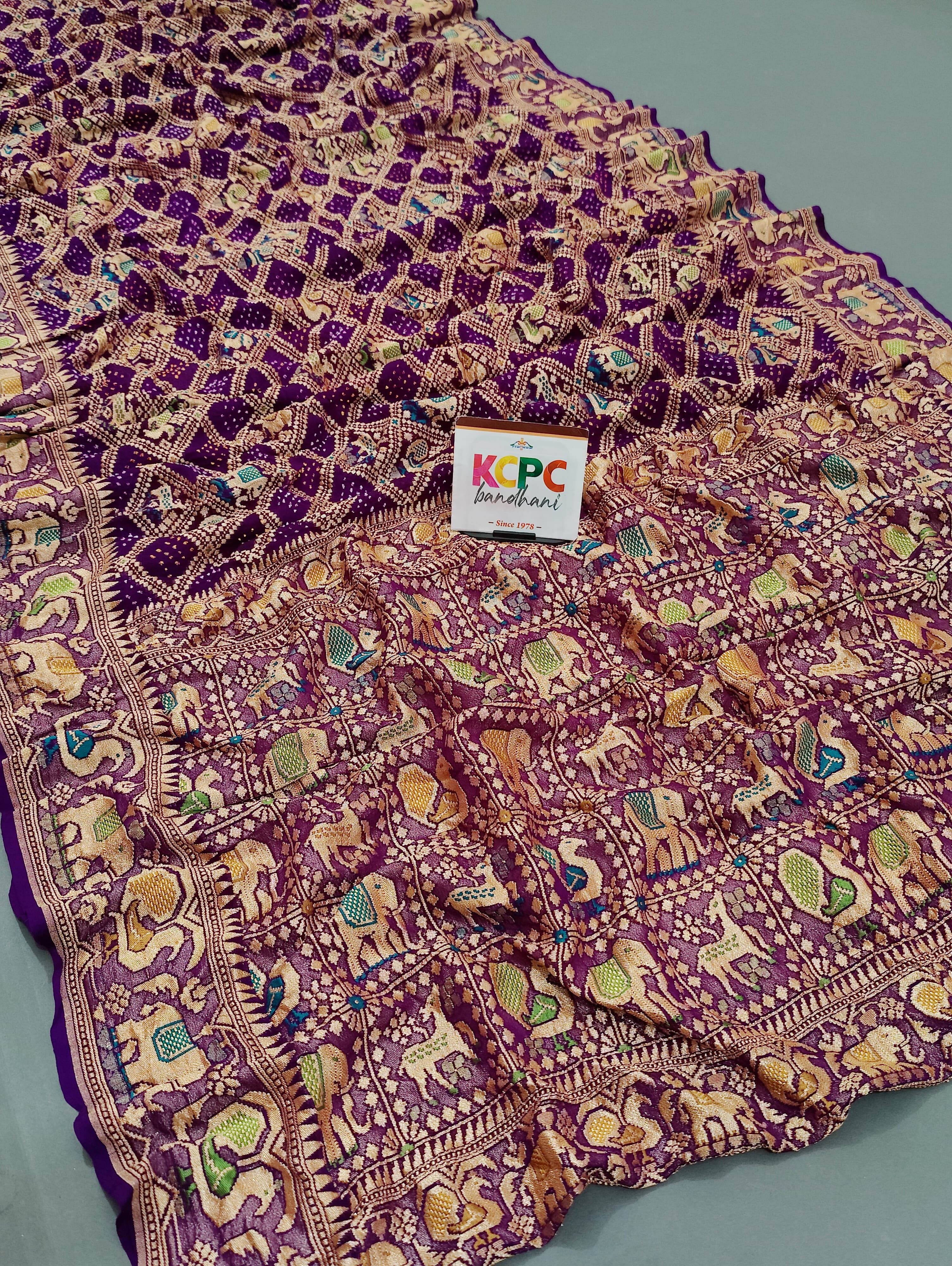 KcPc Pure Figure Design Khaddi Georgette Janglaw Bandhani Neemzari Saree Dark Purple