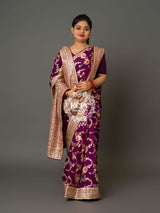 A purple Banarasi saree with floral patterns
