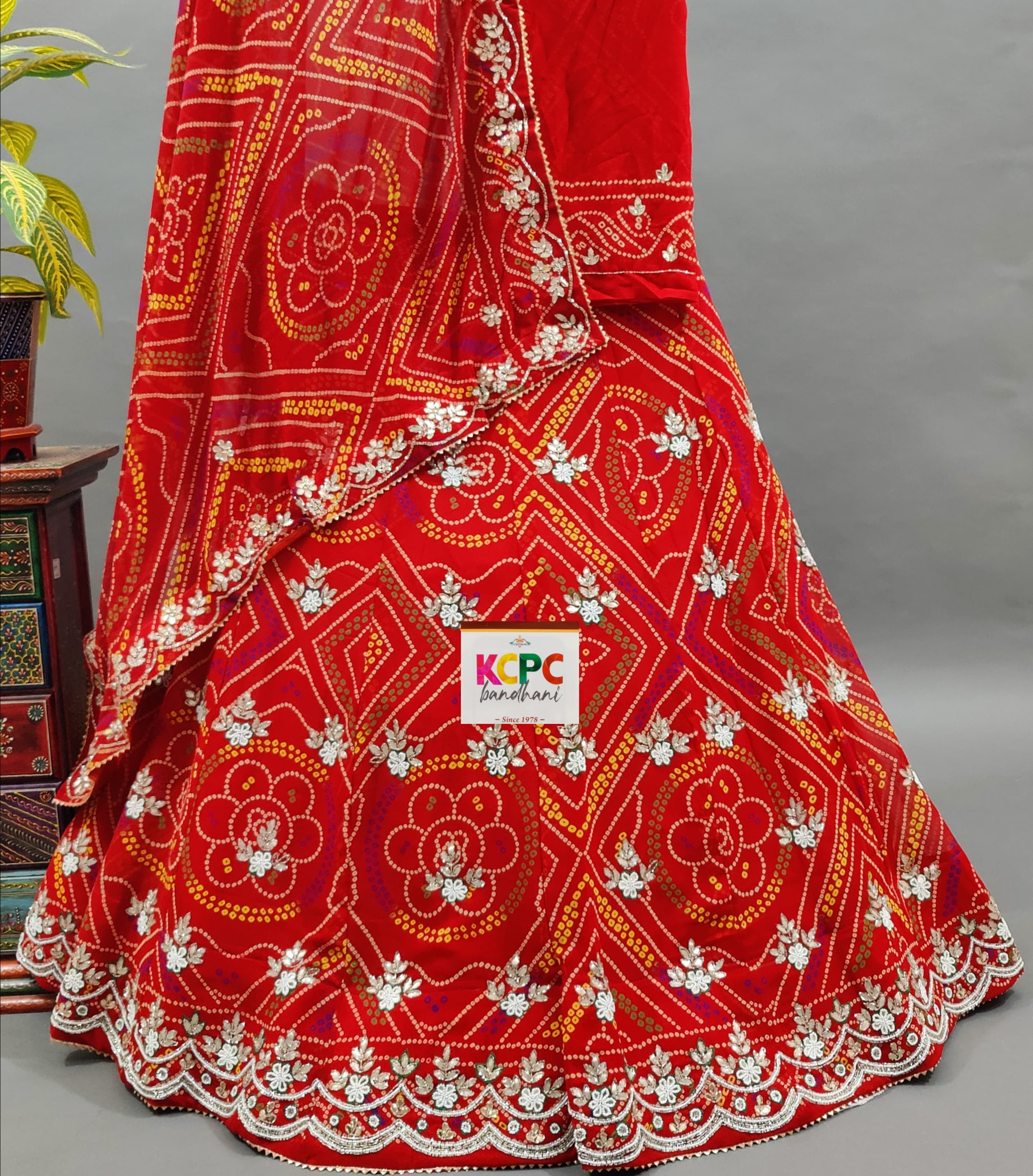 A red georgette bandhej with katdana gotapatti handwork Lehanga
