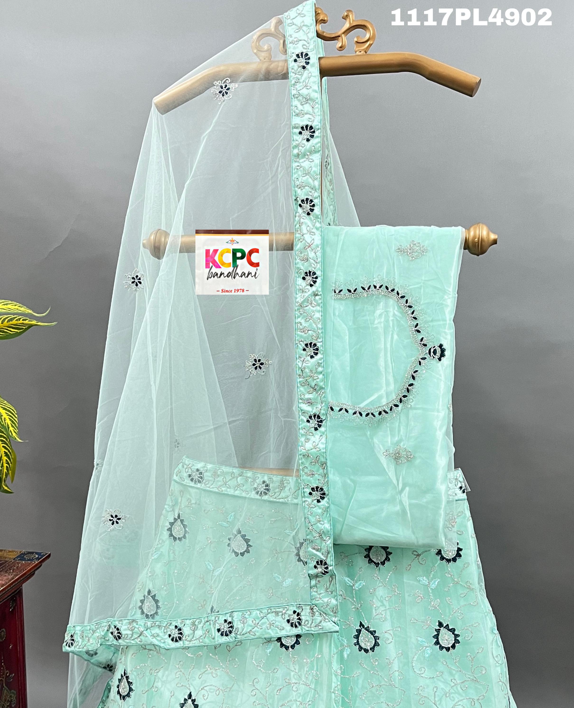 A blue net lehenga set with sequins and embroidery