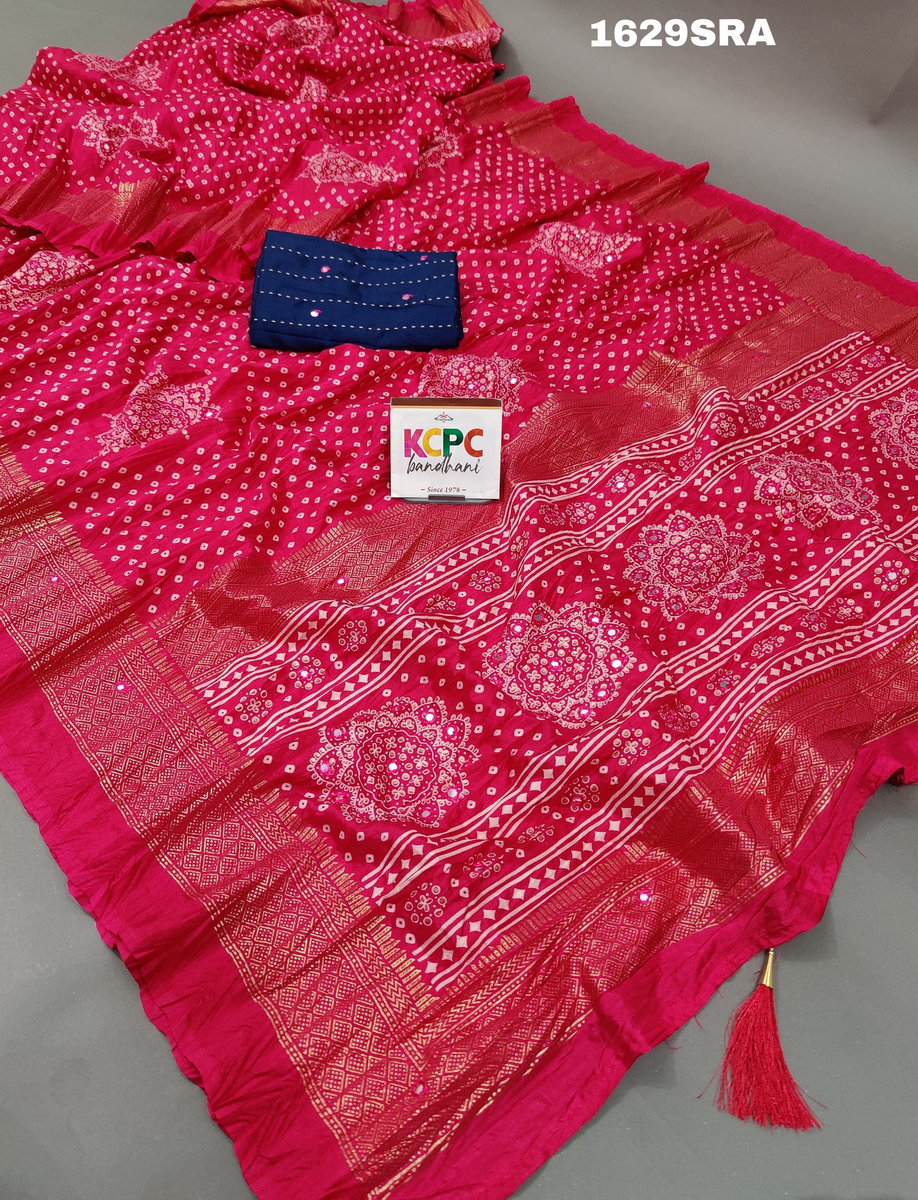 A traditional pink saree with mirror work
