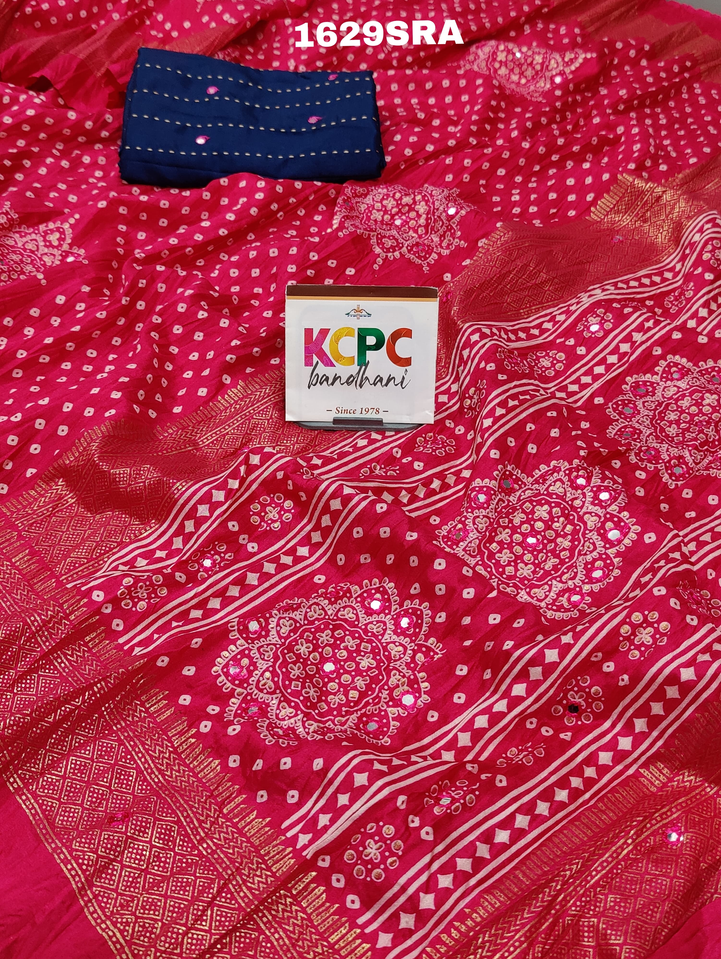 A traditional pink saree with mirror work
