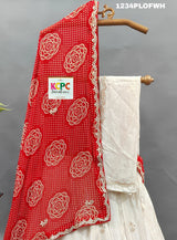 A red and white traditional lehenga set with dupatta and gota work