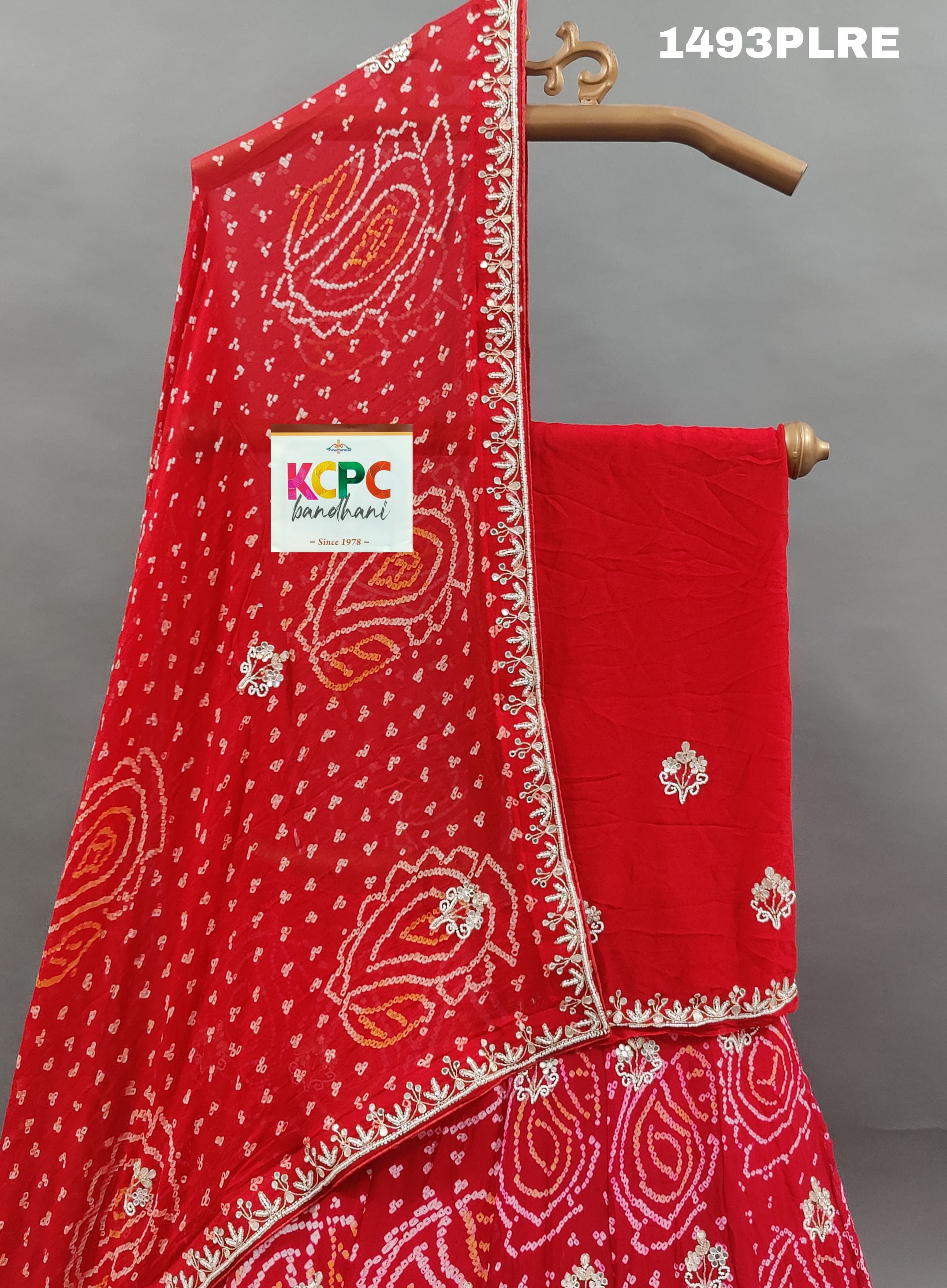 A red lehenga with gota work