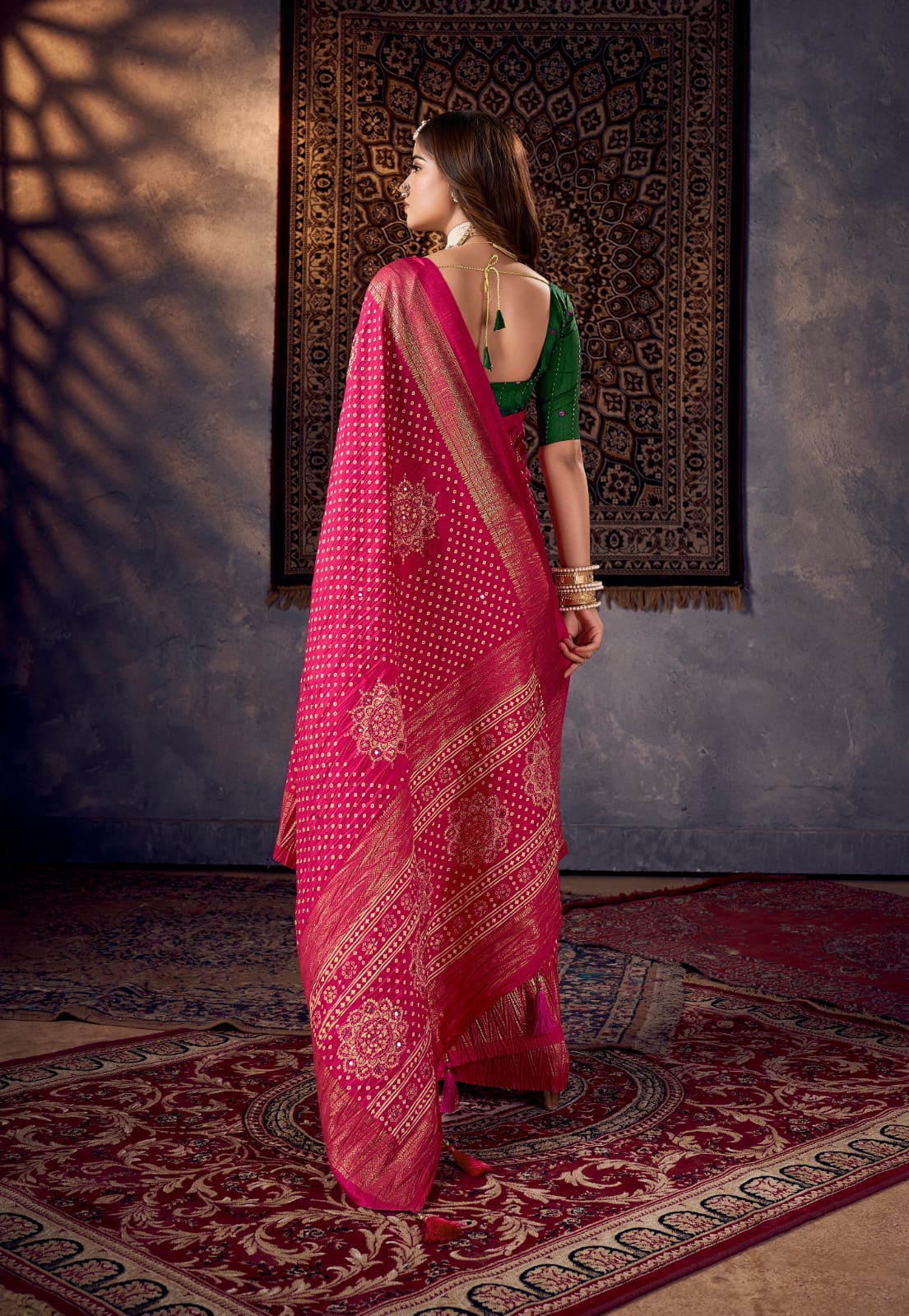 A traditional pink saree with mirror work