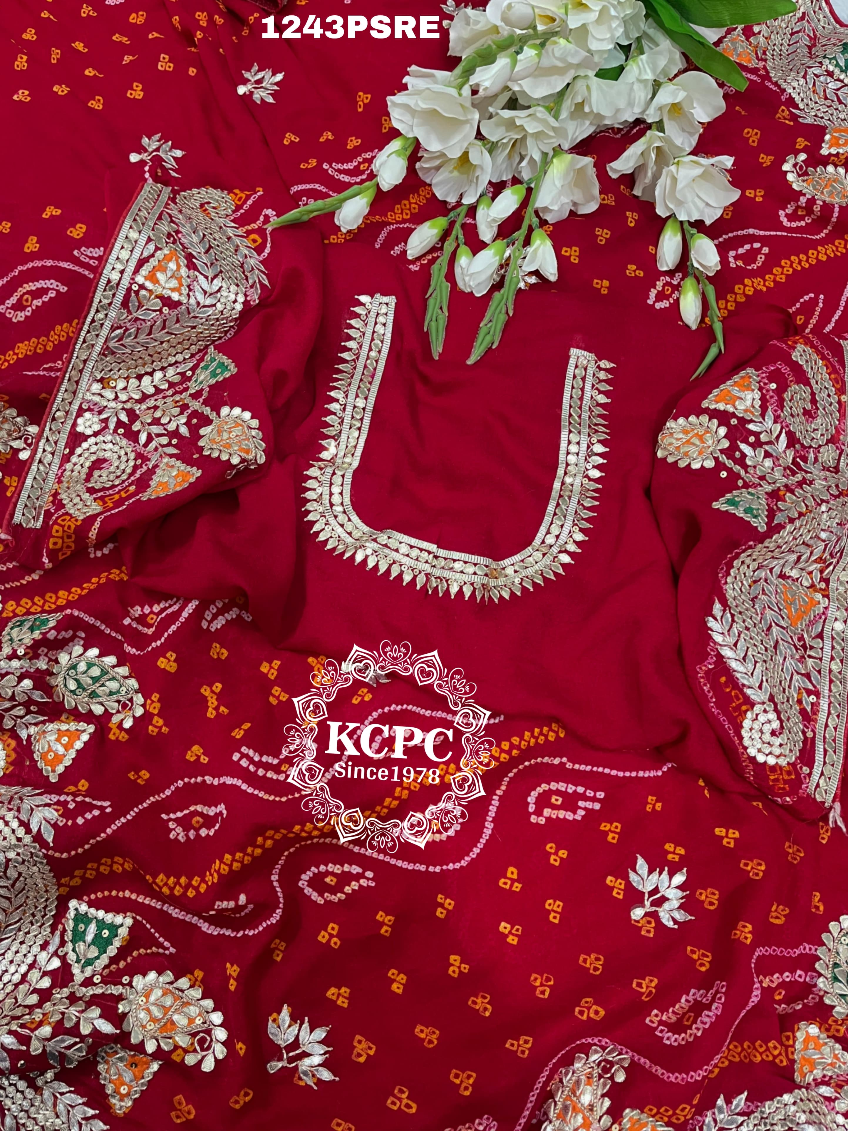 A red bandhani saree with gota patti work