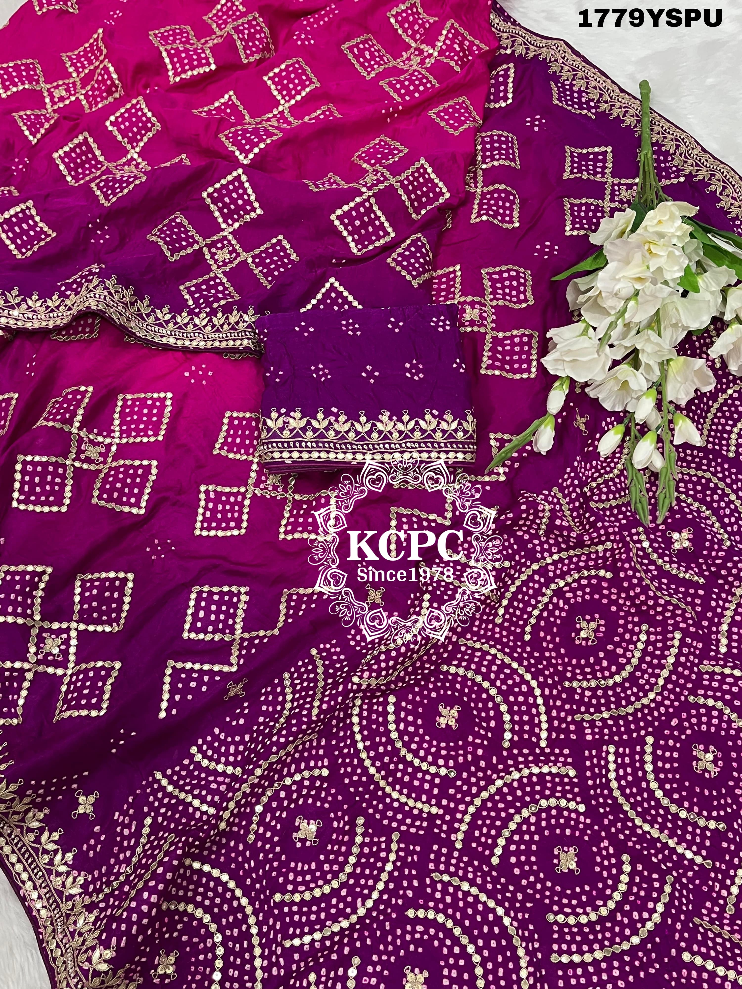 A purple and pink bandhani saree with heavy gotapatti work