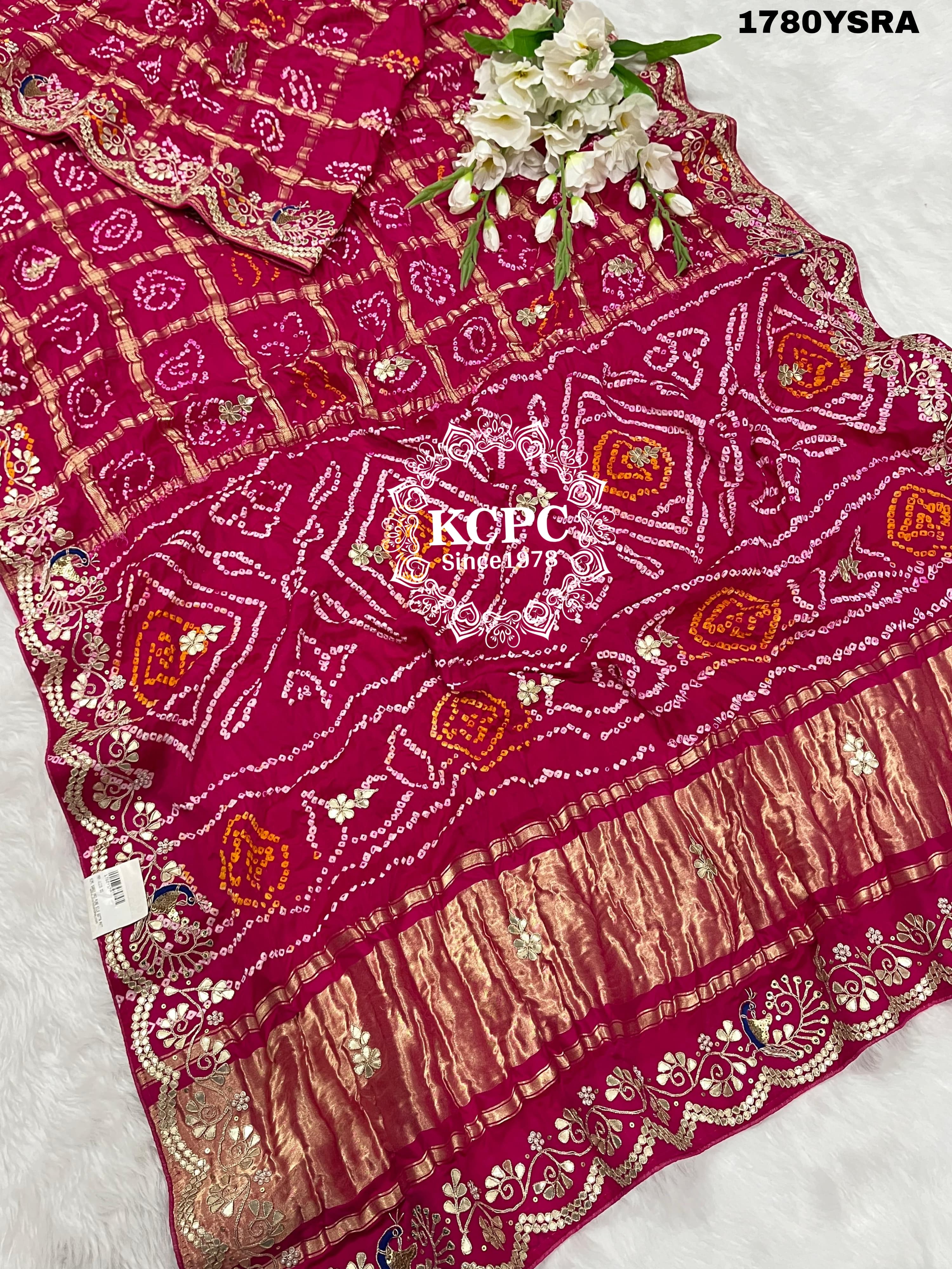 A pink and red pure gaji silk saree with bandhani style
