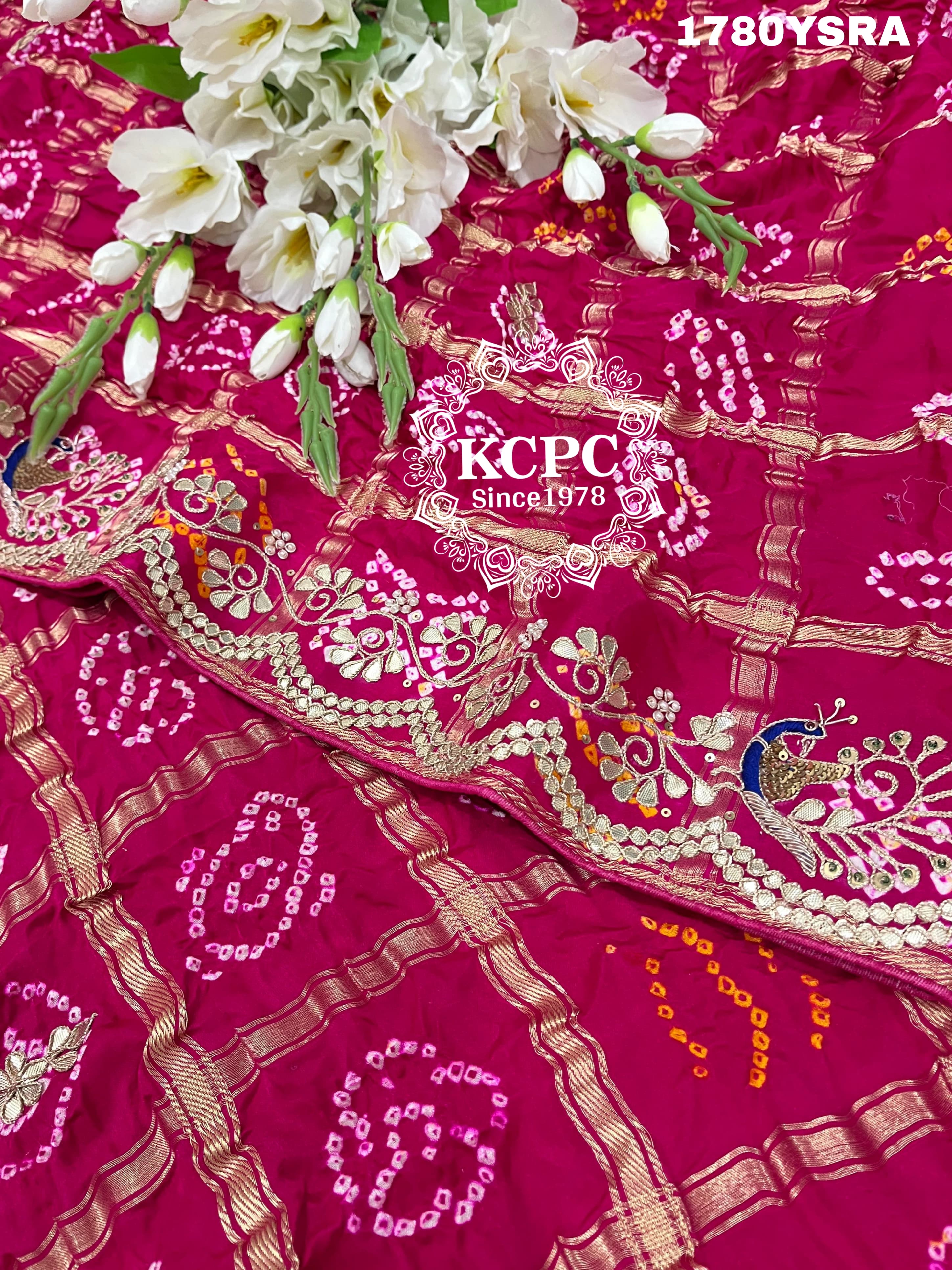 A pink and red pure gaji silk saree with bandhani style