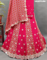 A traditional wear lehenga set with bandhani print and white bead work