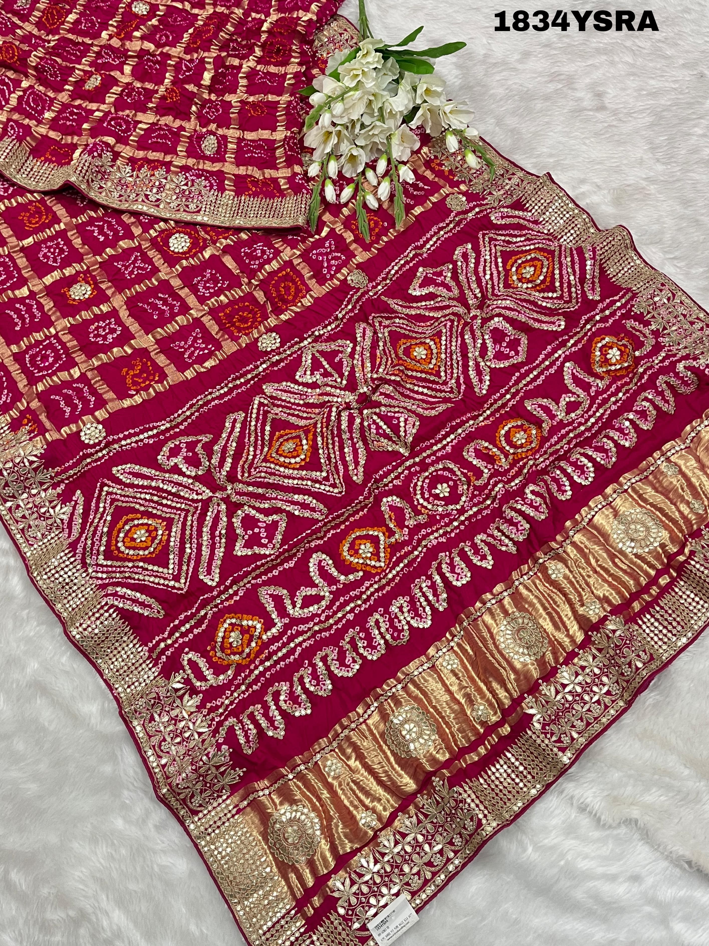red silk saree with gotapatti work and floral embellishments