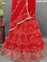A red lehenga set with gota patti work
