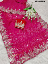 A pink saree with Bandhej pattern and Gotapatti work