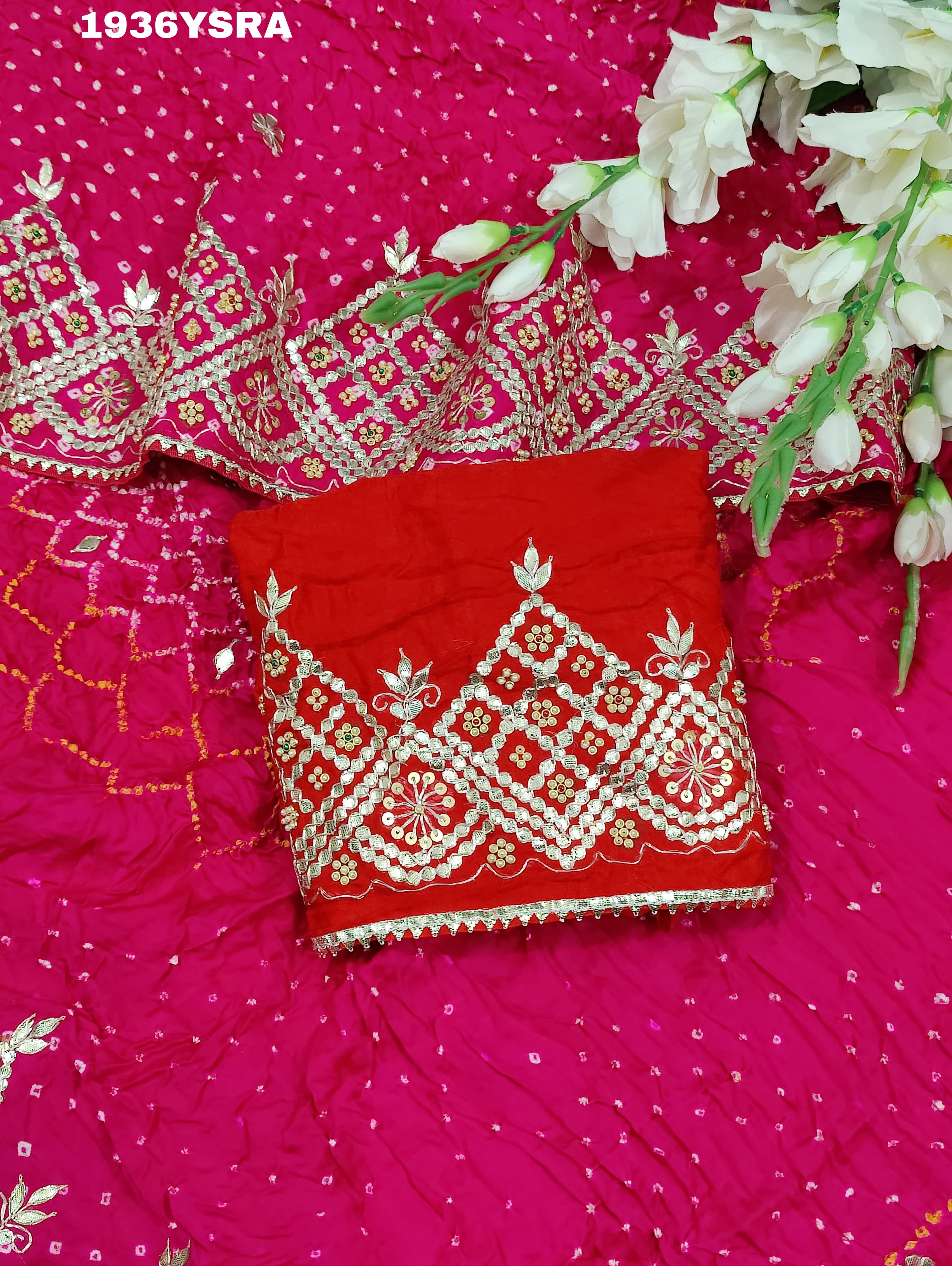A pink saree with Bandhej pattern and Gotapatti work