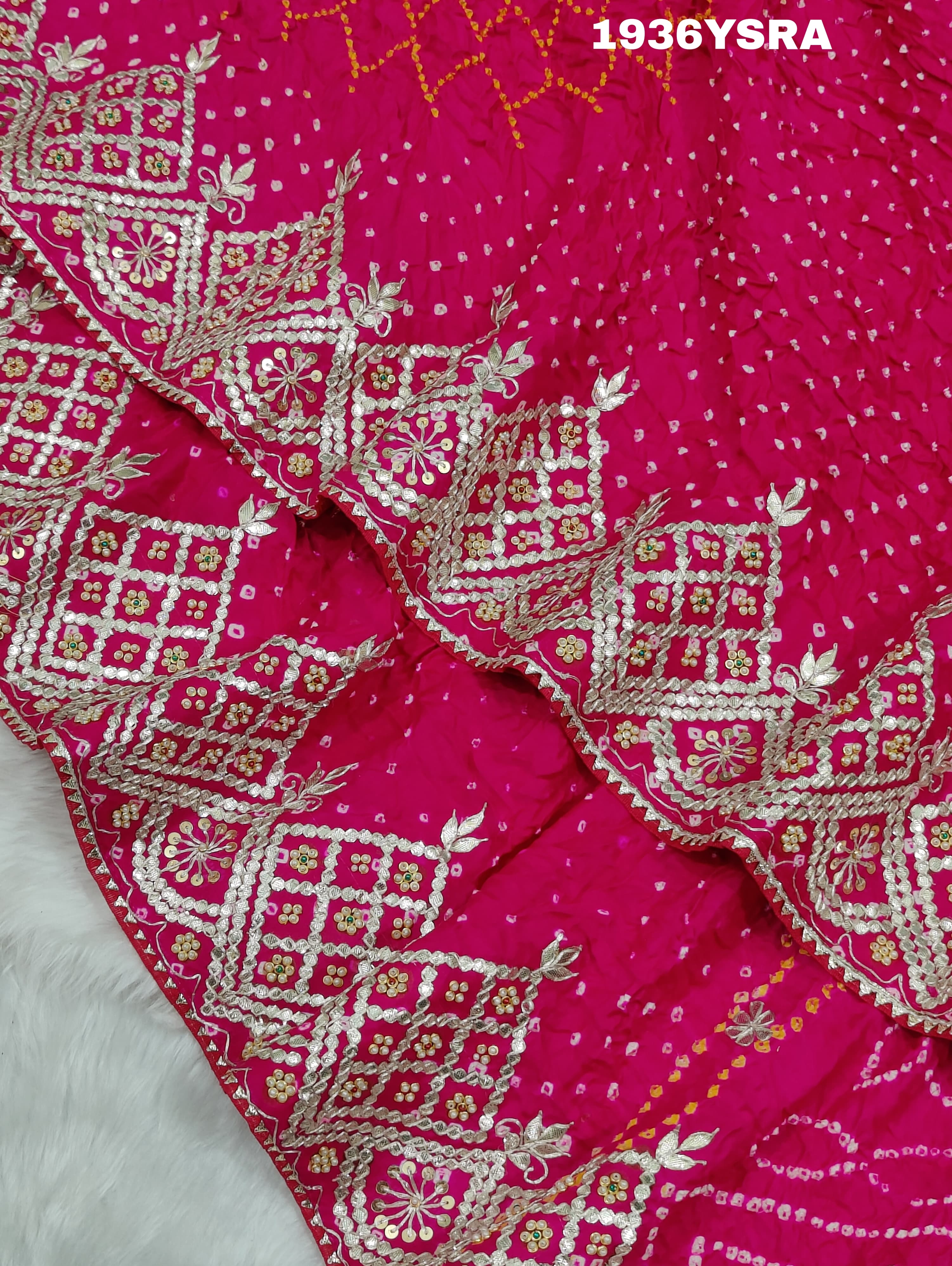 A pink saree with Bandhej pattern and Gotapatti work