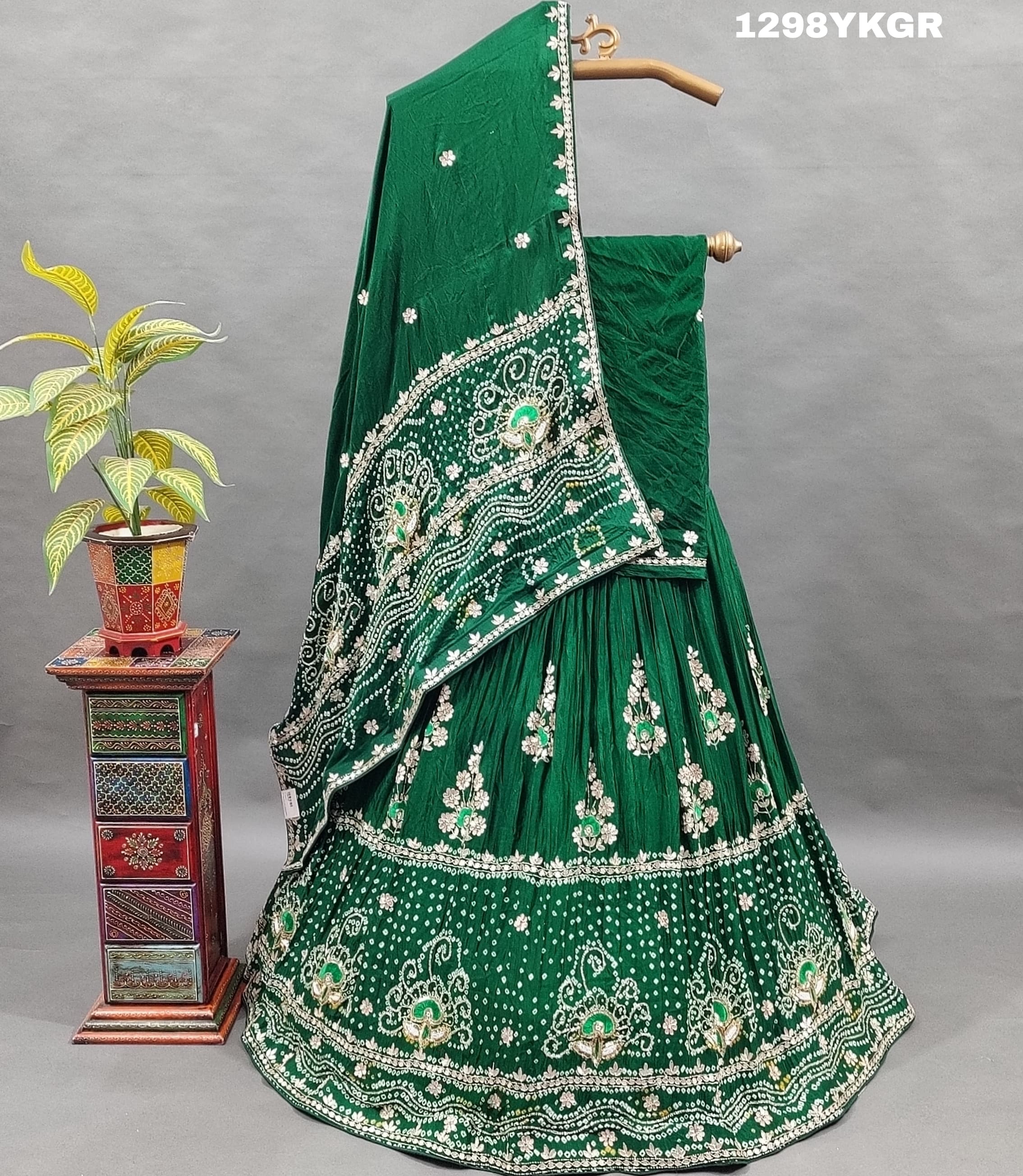 A green lehenga set with gotapati work