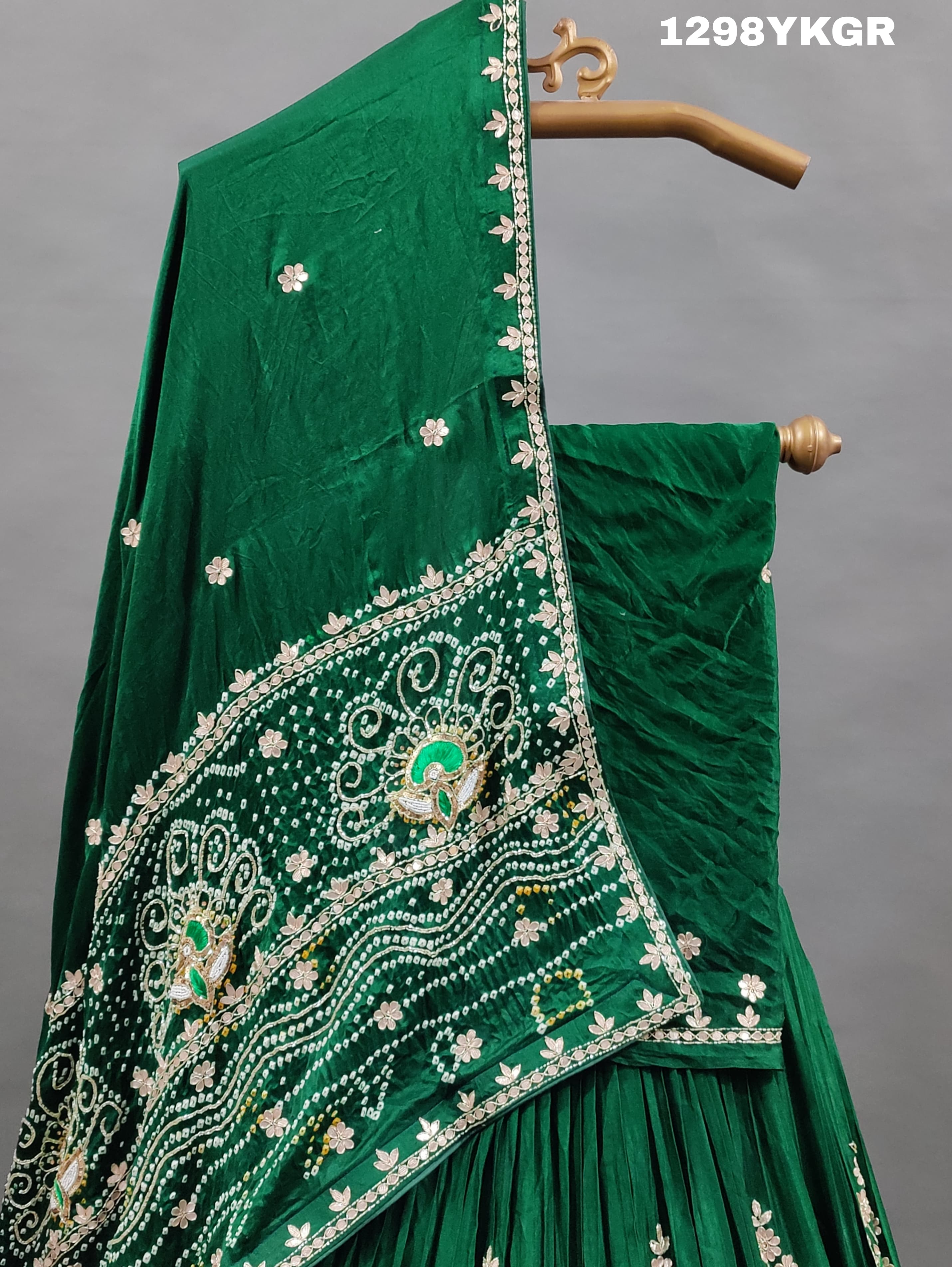 A green lehenga set with gotapati work