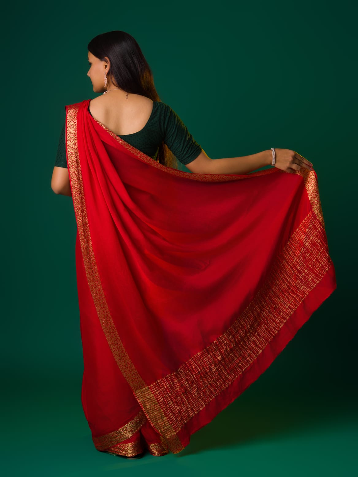Ared saree with a zari border