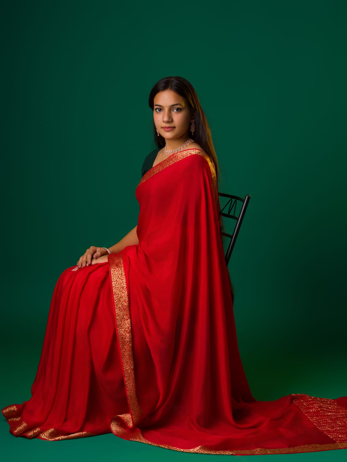 Ared saree with a zari border