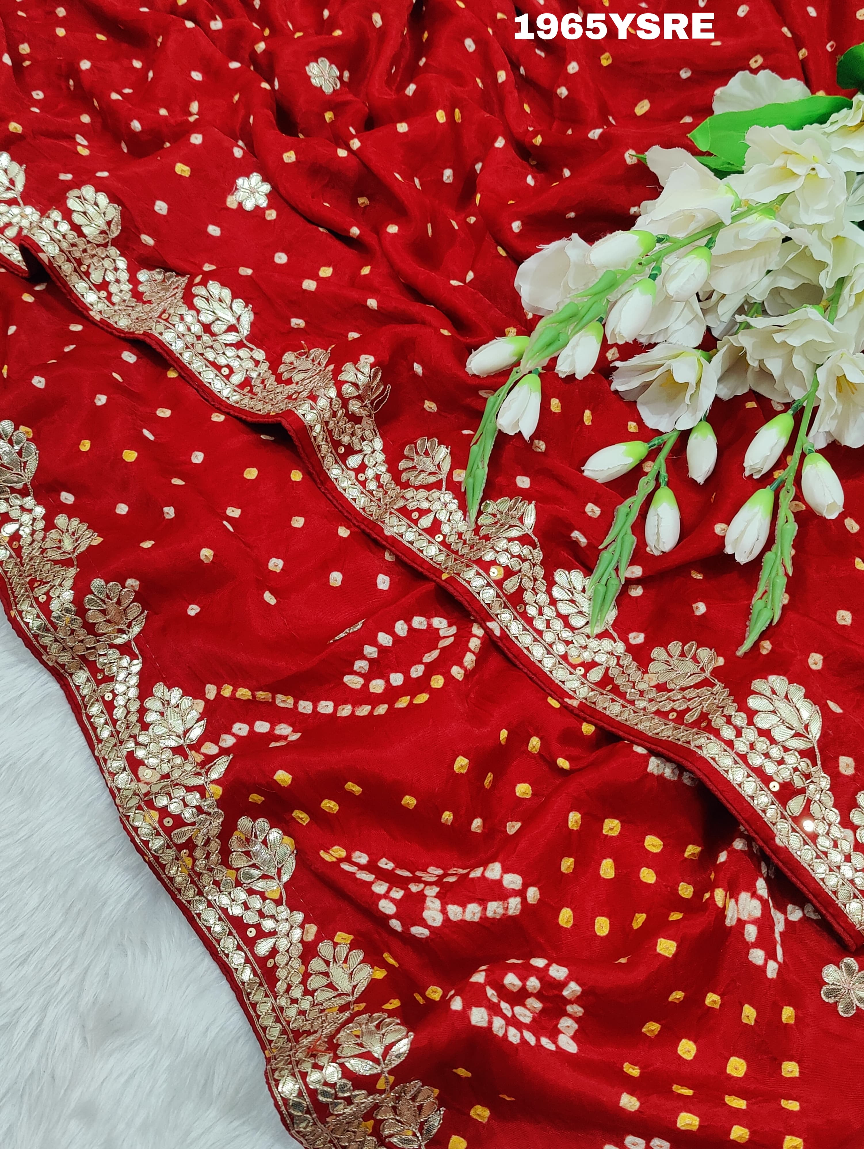 A red and gold modal silk saree with gota patti work