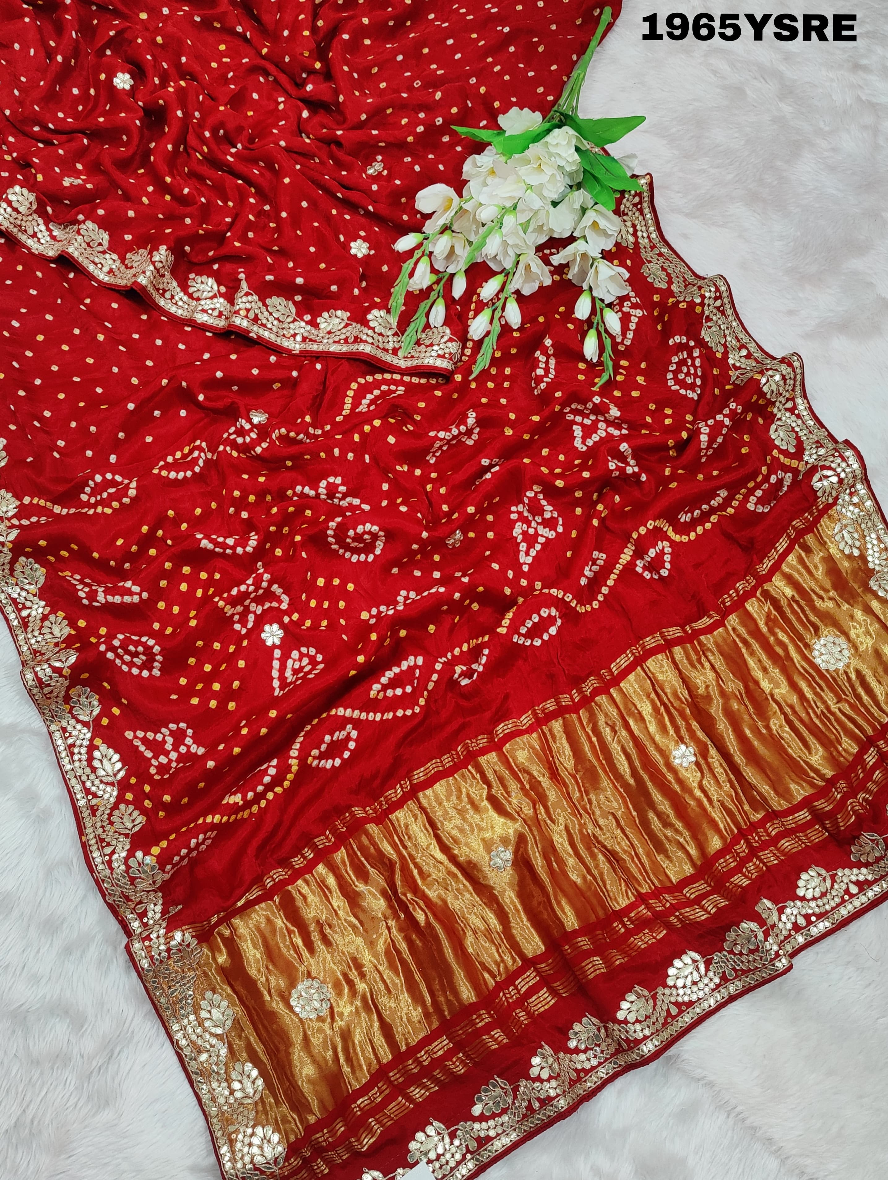 A red and gold modal silk saree with gota patti work
