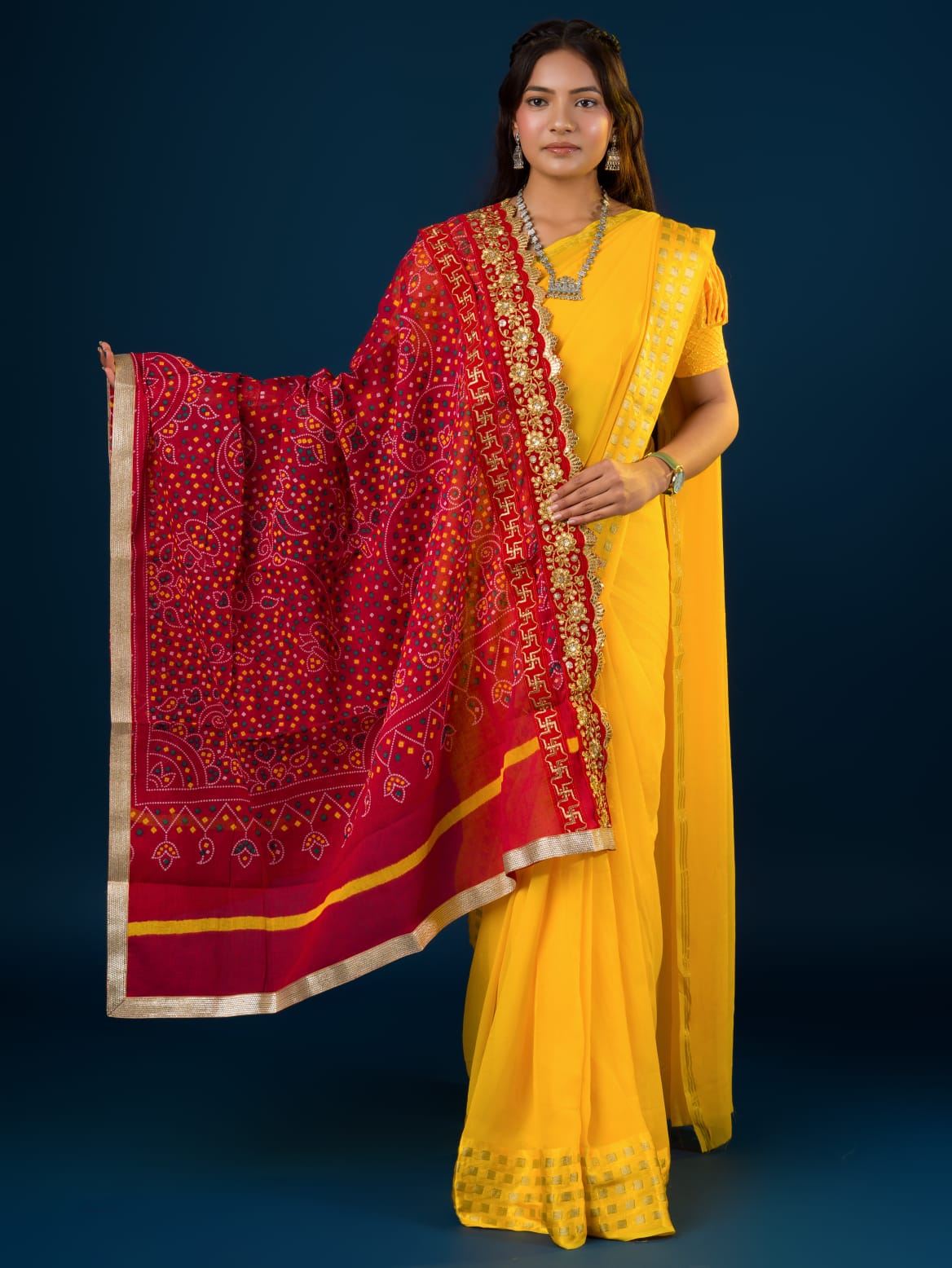 Ared and yellow traditional Marwadi chunri with floral and geometric patterns and a border.