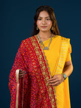 Ared and yellow traditional Marwadi chunri with floral and geometric patterns and a border.