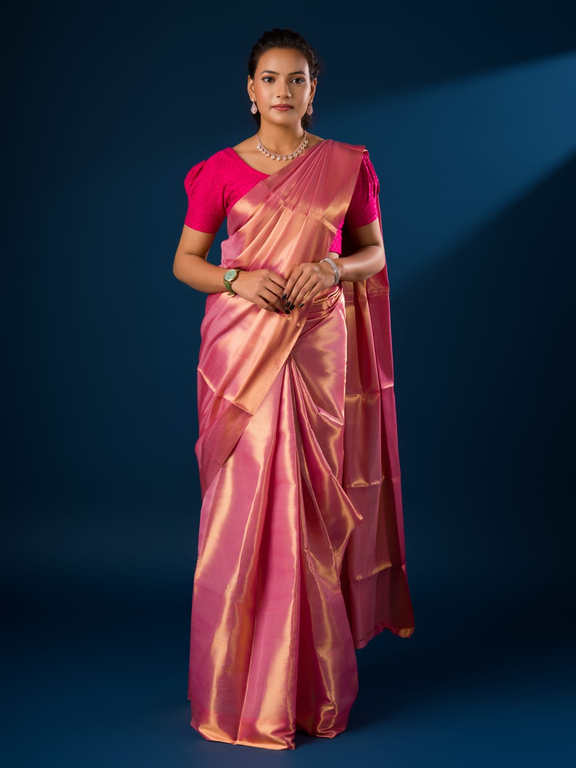 A pink and golden Banarasi silk saree with tissue pattern
