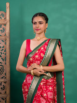 A green and red pashmina cotton silk saree with a patola style pattern