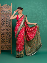 A green and red pashmina cotton silk saree with a patola style pattern