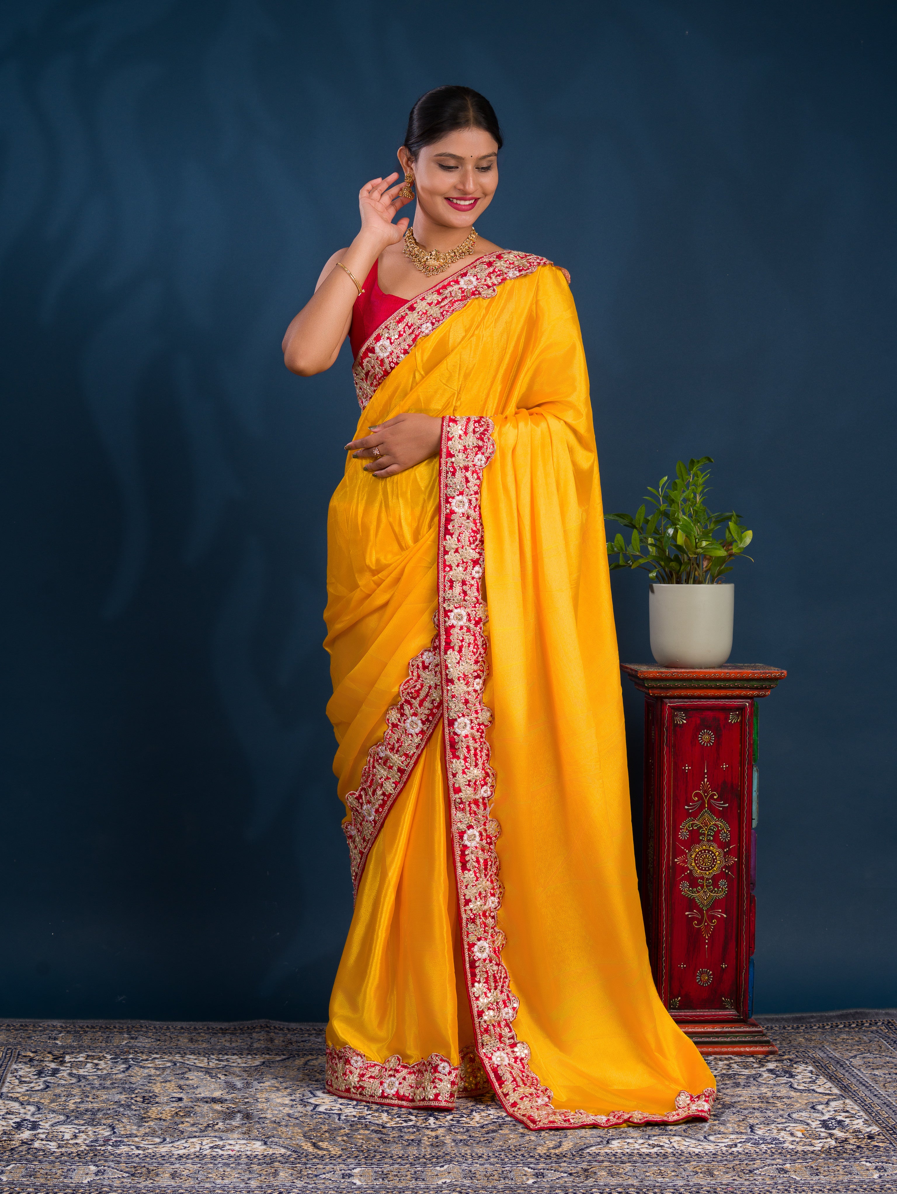 A yellow saree with red borderChinon Silk Bollywood Style With Sequence Gotapatti Work Saree