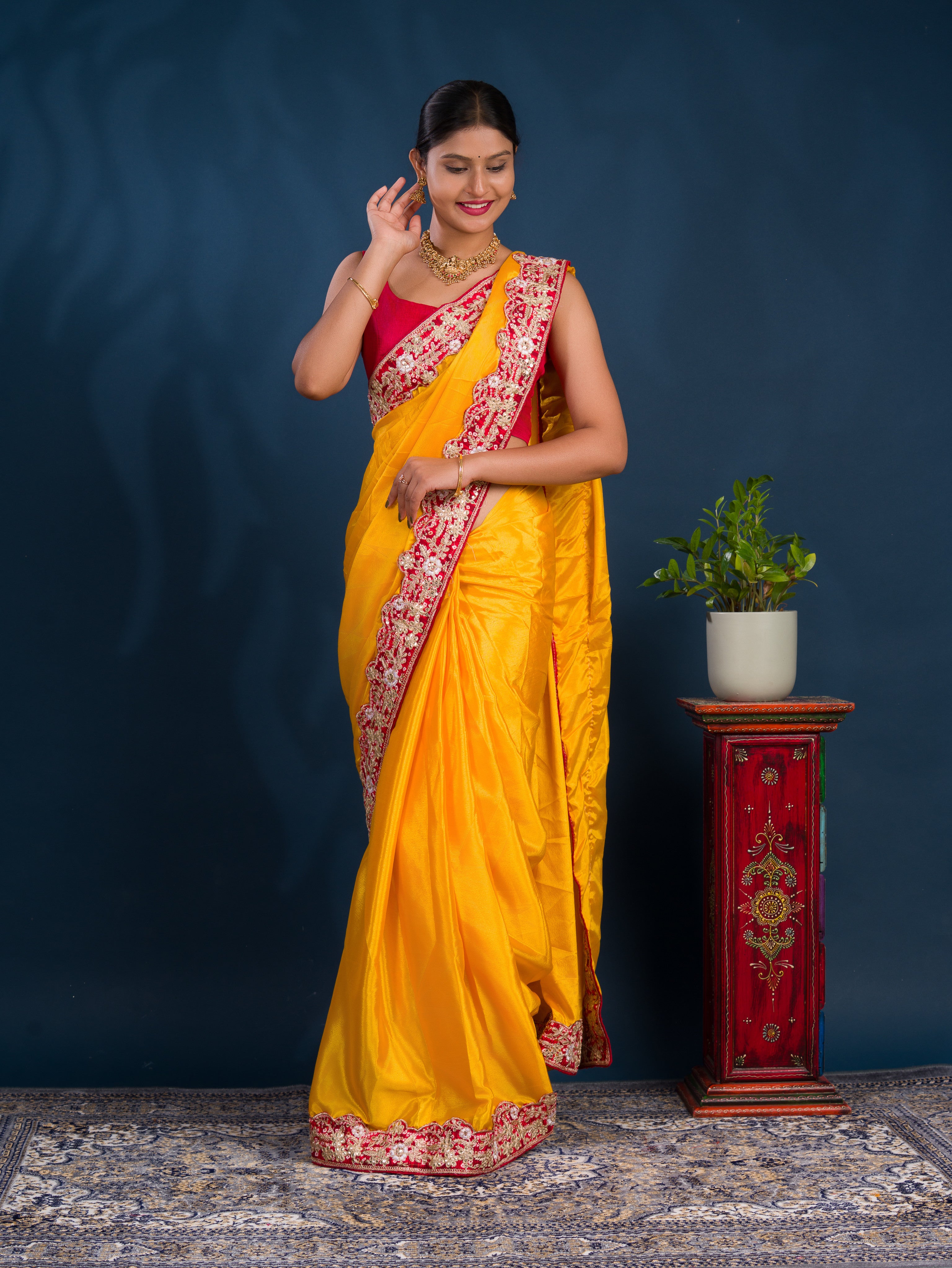 A yellow saree with red borderChinon Silk Bollywood Style With Sequence Gotapatti Work Saree