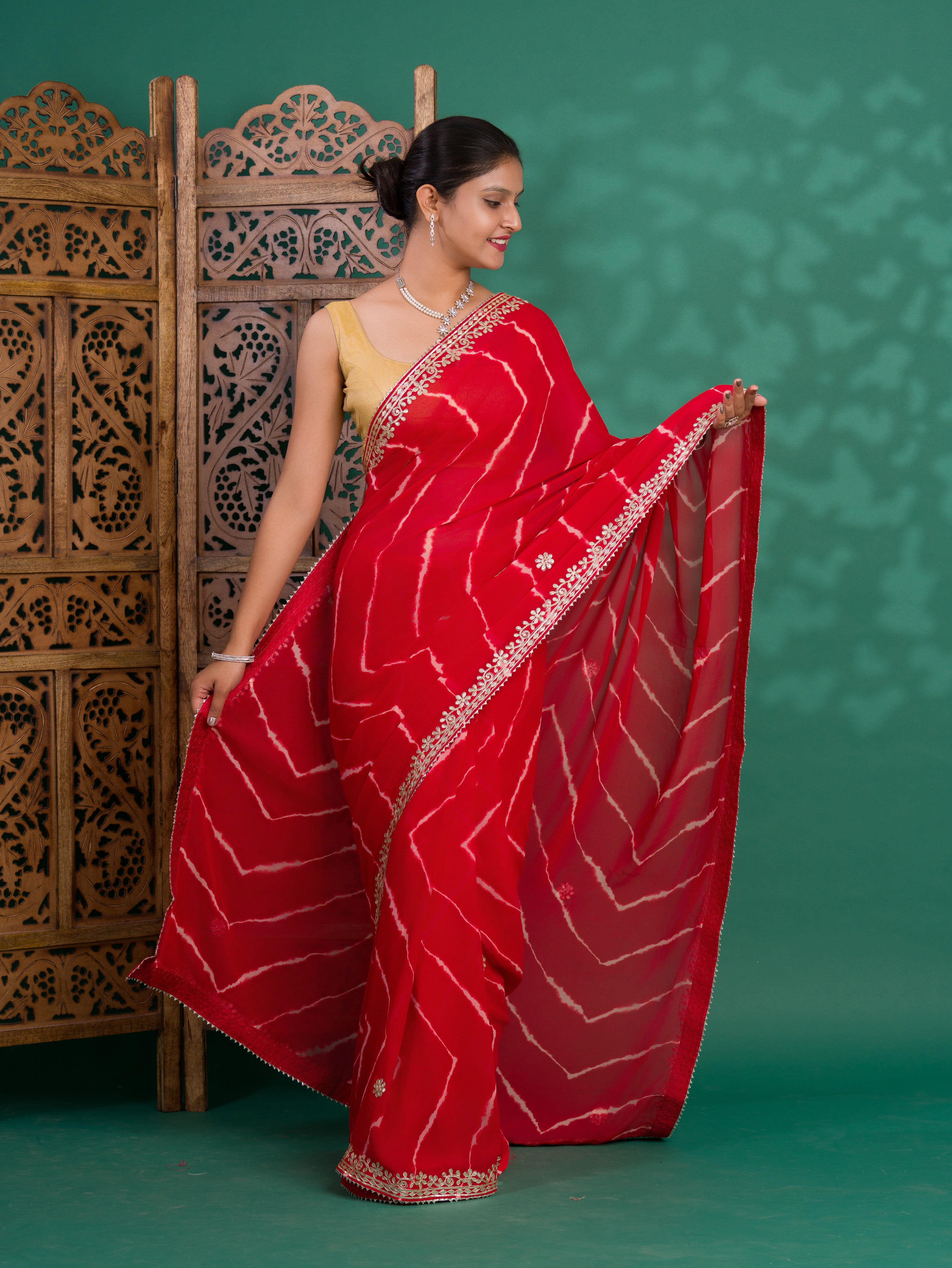 Chiffon Leheriya Style Wih Gotapatti Work Saree in red colour