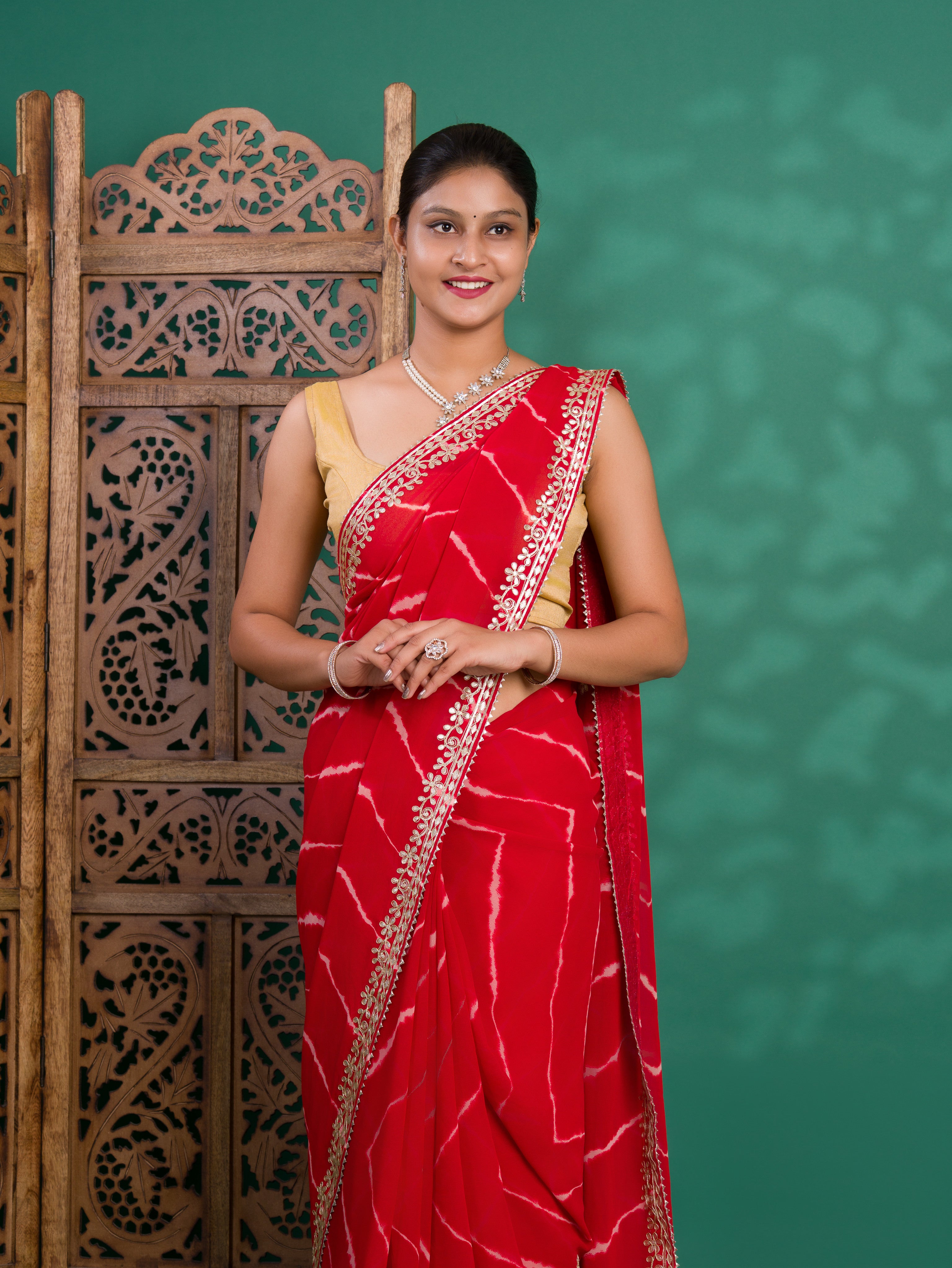 Chiffon Leheriya Style Wih Gotapatti Work Saree in red colour