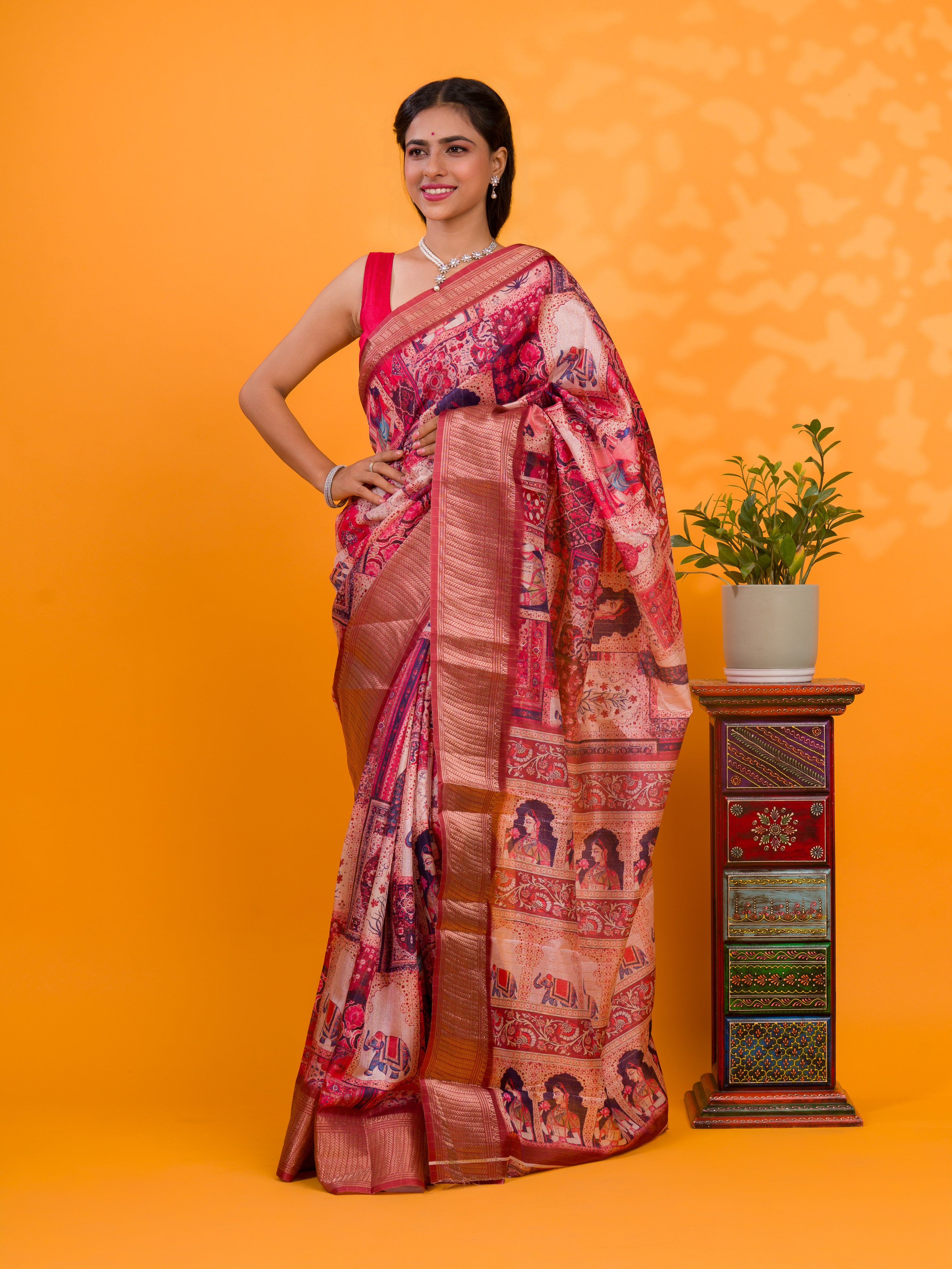 A saree with a kalamkari style pattern in maroon colors, with zari weaving and a Banarasi border. under 1000